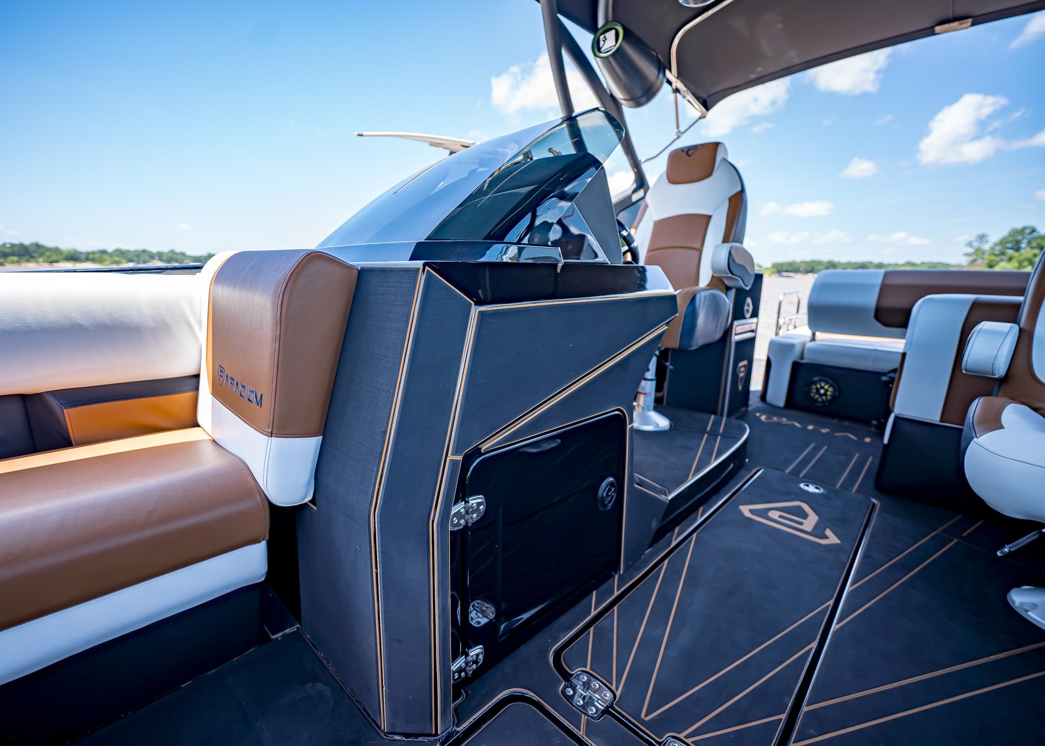 Luxurious interior of 2025 Paradigm 236 boat with modern seating and sleek design.