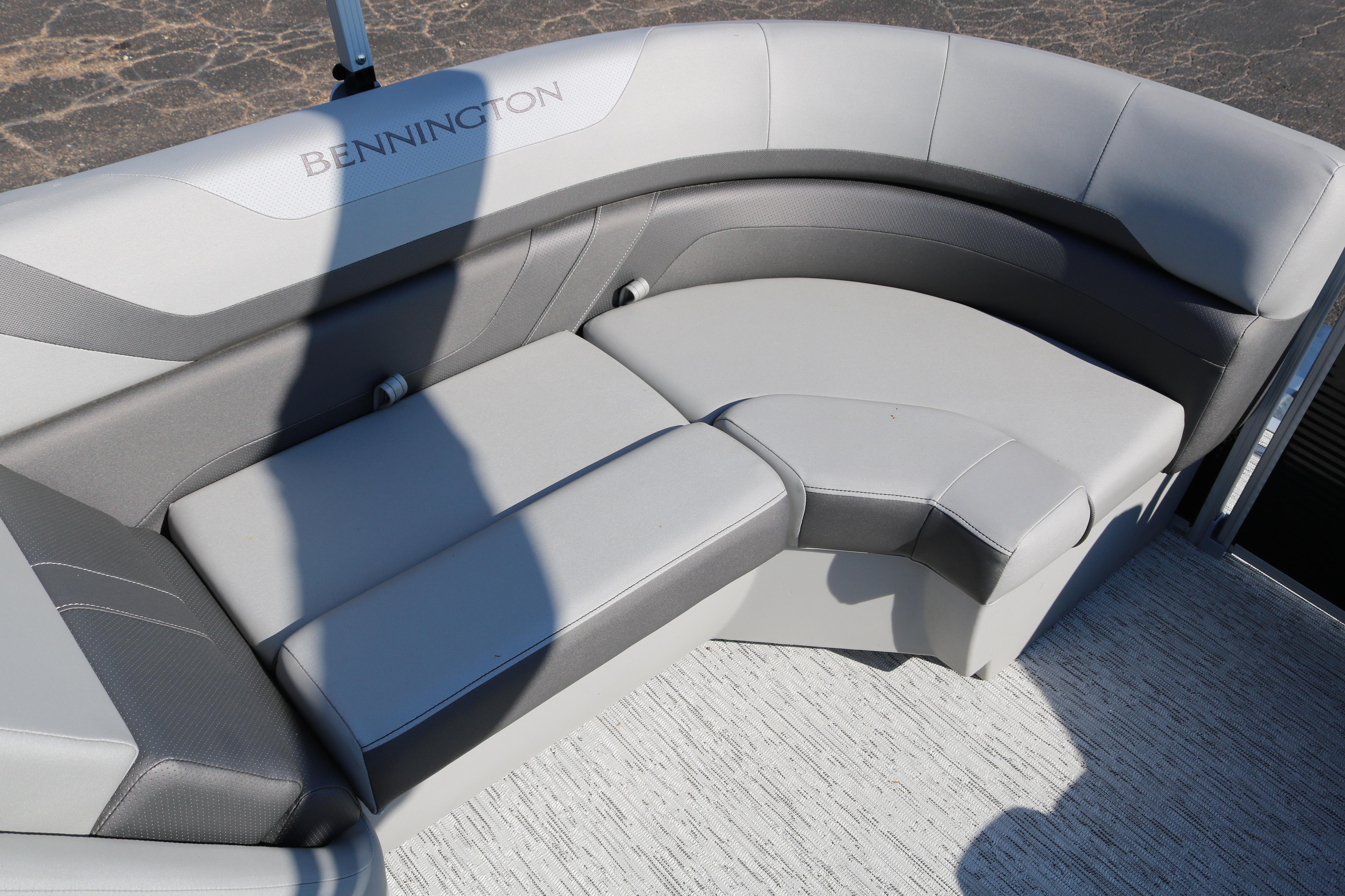 Luxurious seating on 2026 Bennington 22SX Stern Radius boat, featuring sleek gray upholstery.