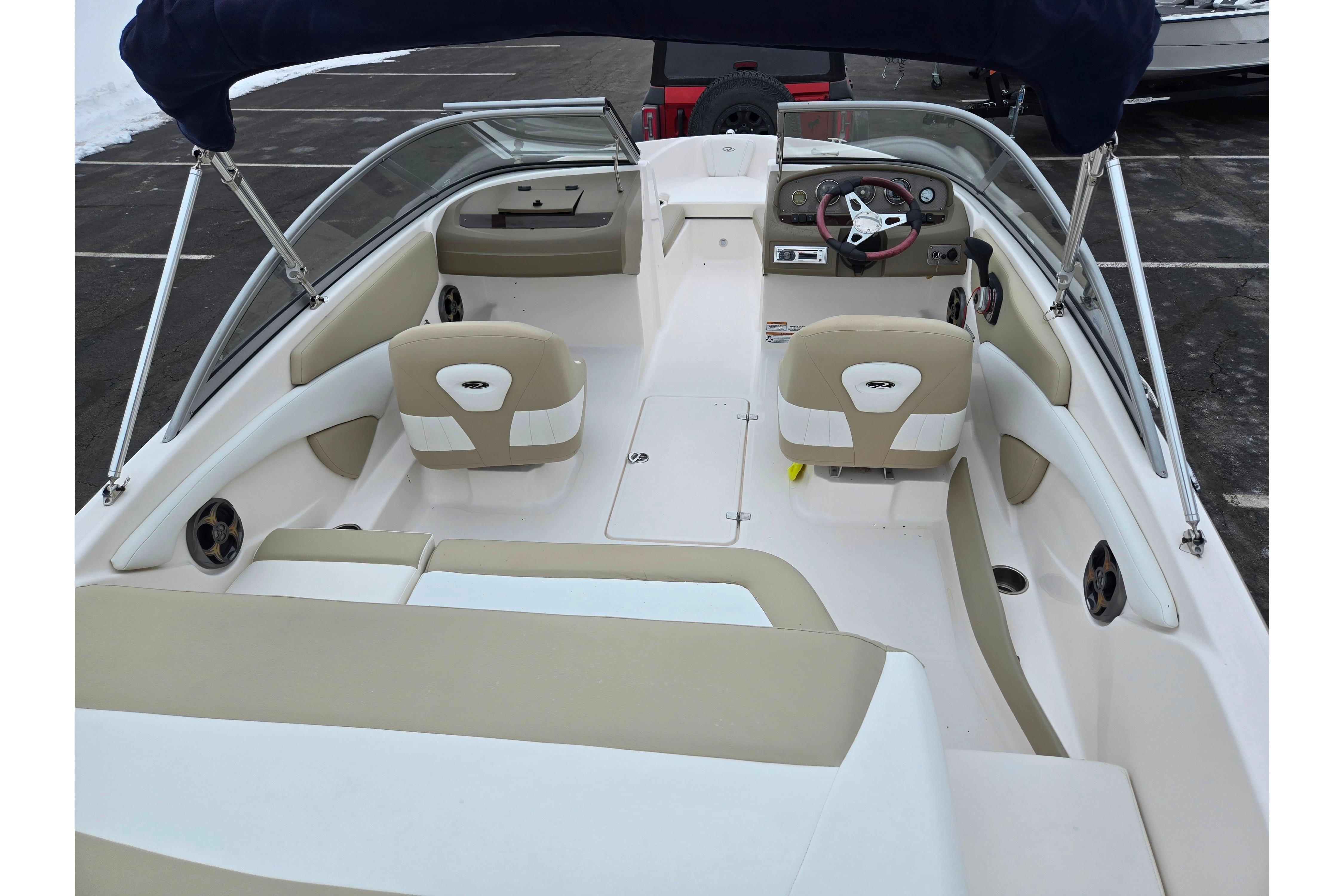 2015 Regal 1900 ES Bowrider interior with beige seating and steering wheel.