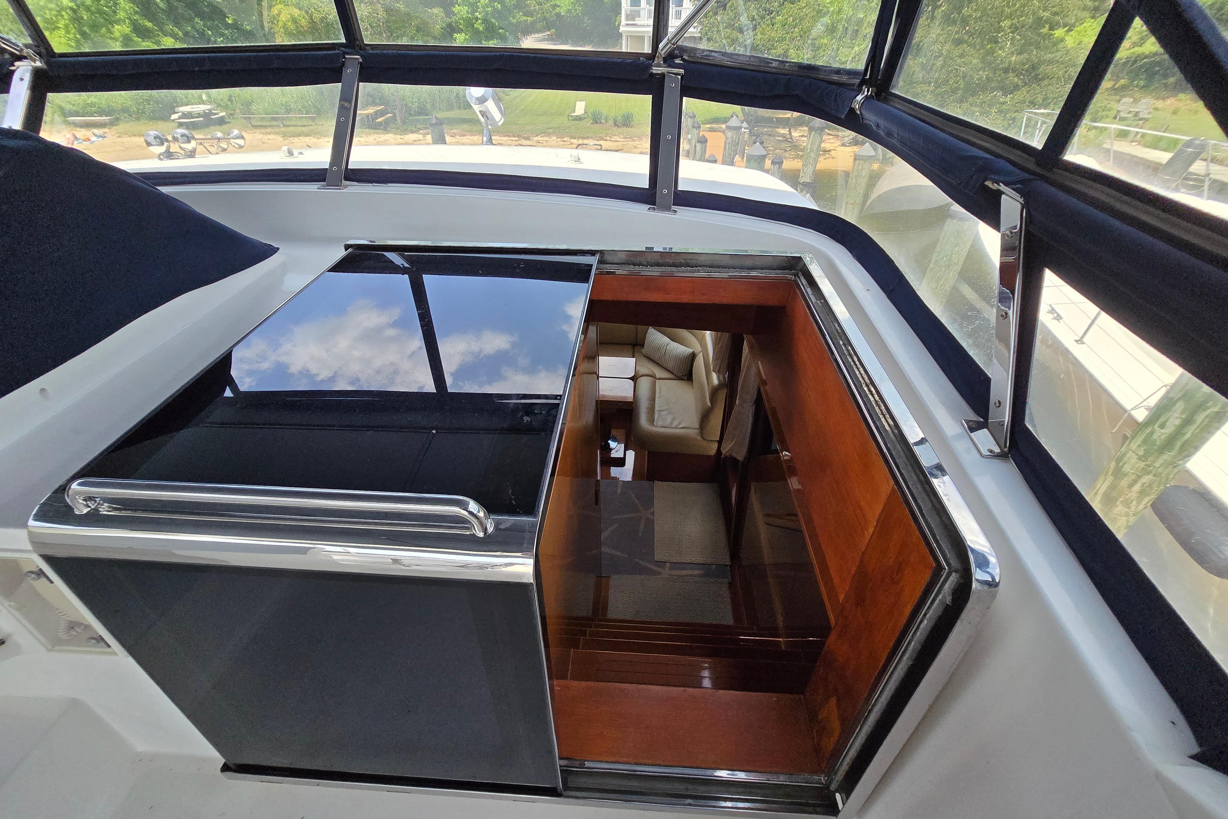 Interior view of 2004 Grand Harbour 58 yacht, featuring luxurious seating and sleek design.