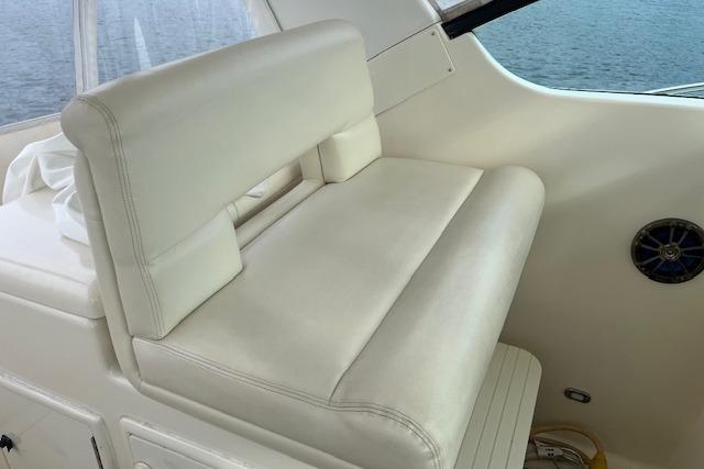 1998 Tiara Yachts 3500 Open interior with white leather seating and ocean view.