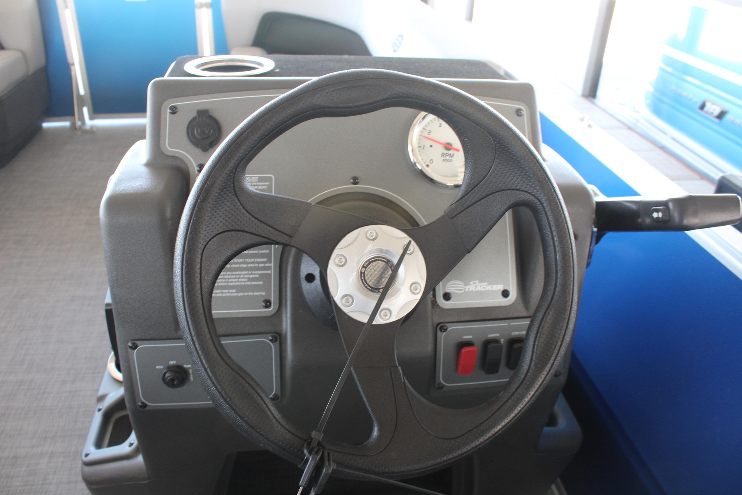 Steering console of 2026 Sun Tracker Party Barge 16 DLX pontoon boat.