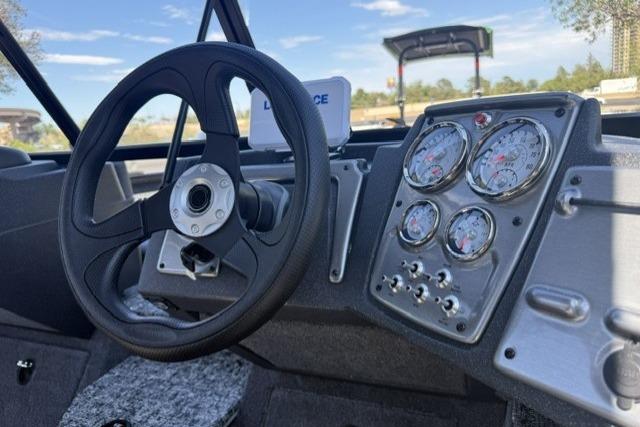 2026 Tracker Pro Guide V-175 Combo dashboard with steering wheel and instrument panel.