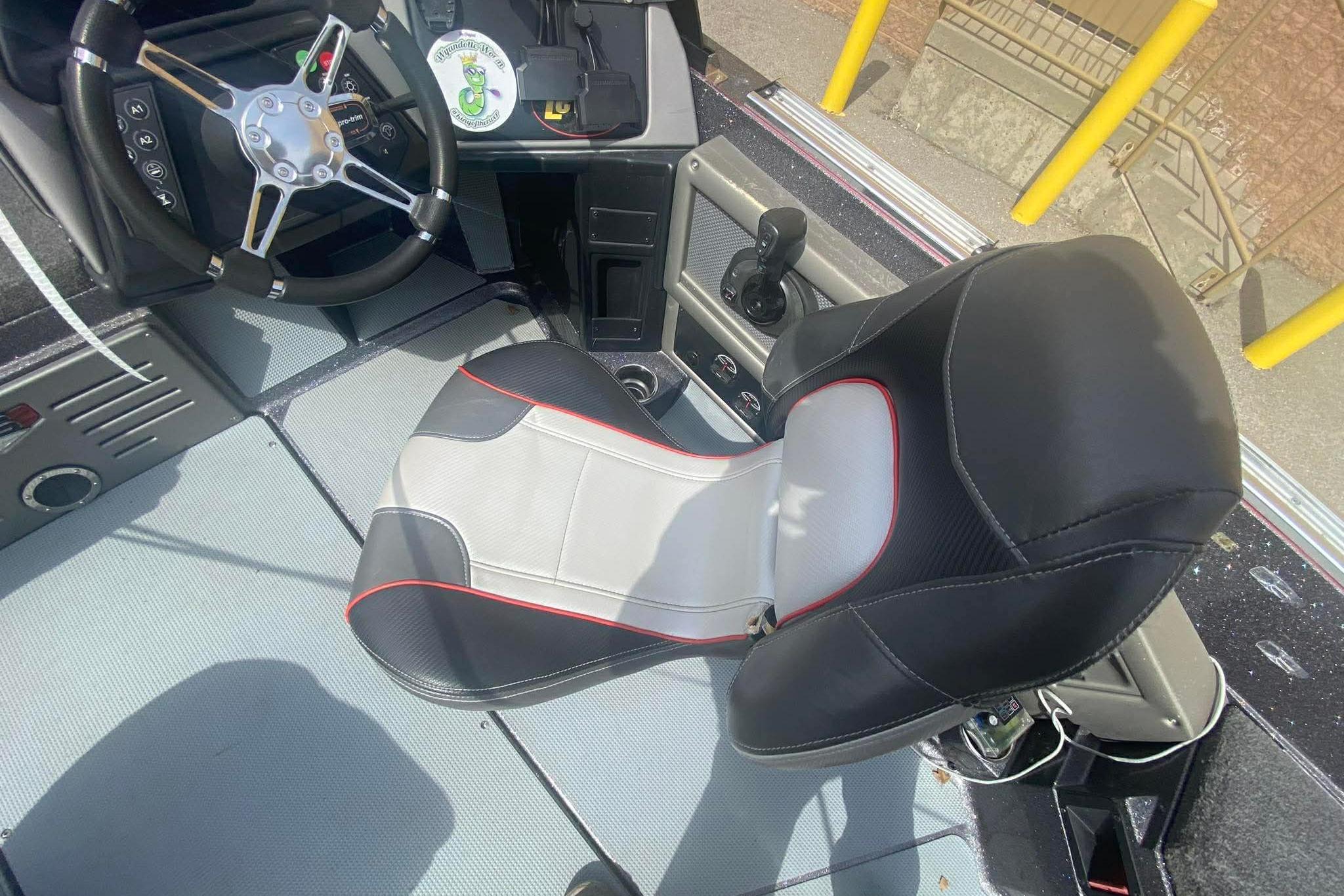 2017 Ranger 621FS Fisherman boat interior with steering wheel and cushioned seat.