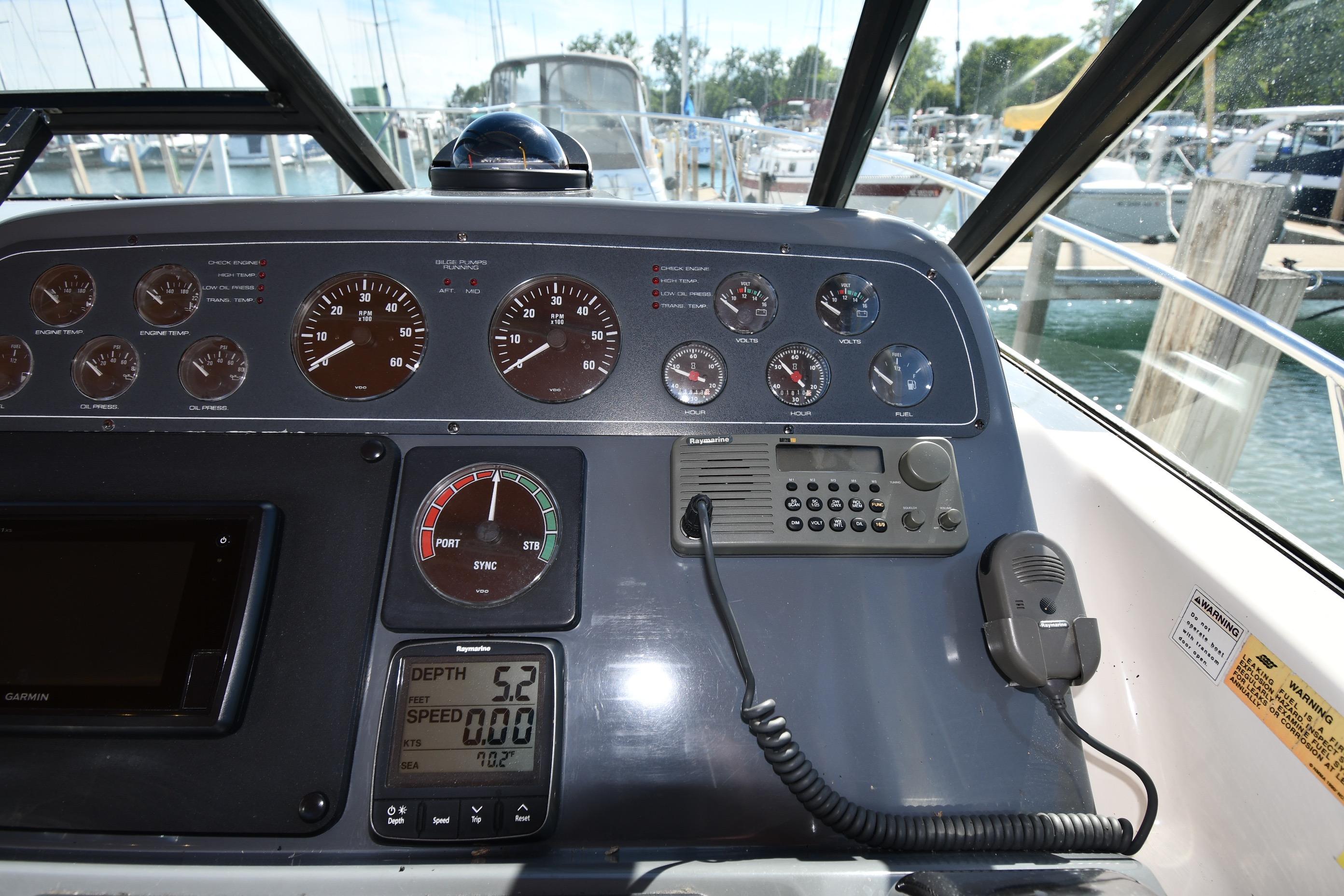 Dashboard of a 1998 Tiara Yachts 3100 Open with gauges and navigation equipment.