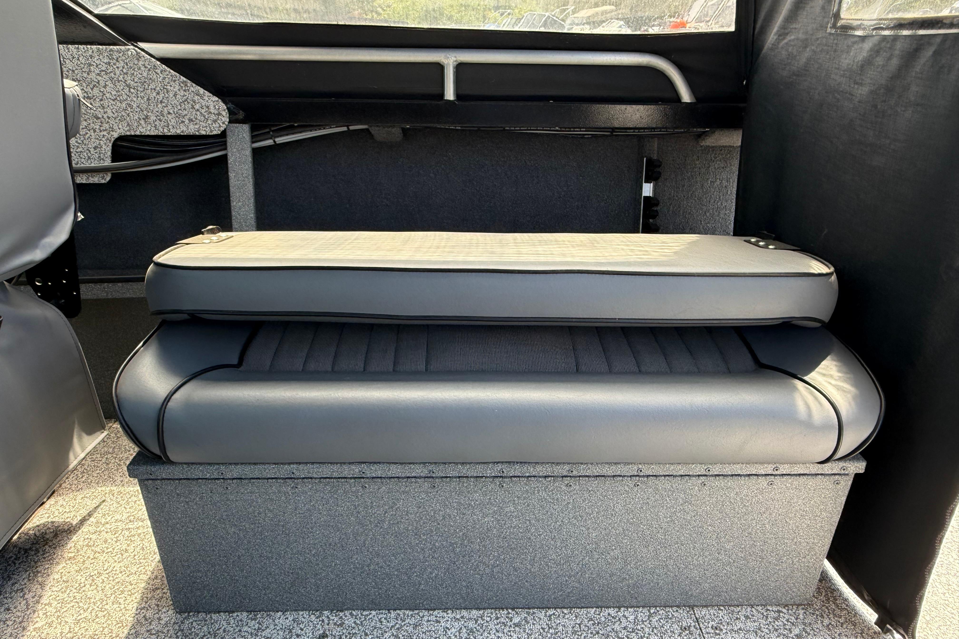 2019 Alumaweld Intruder Hard Top 22' interior seating with gray cushions.