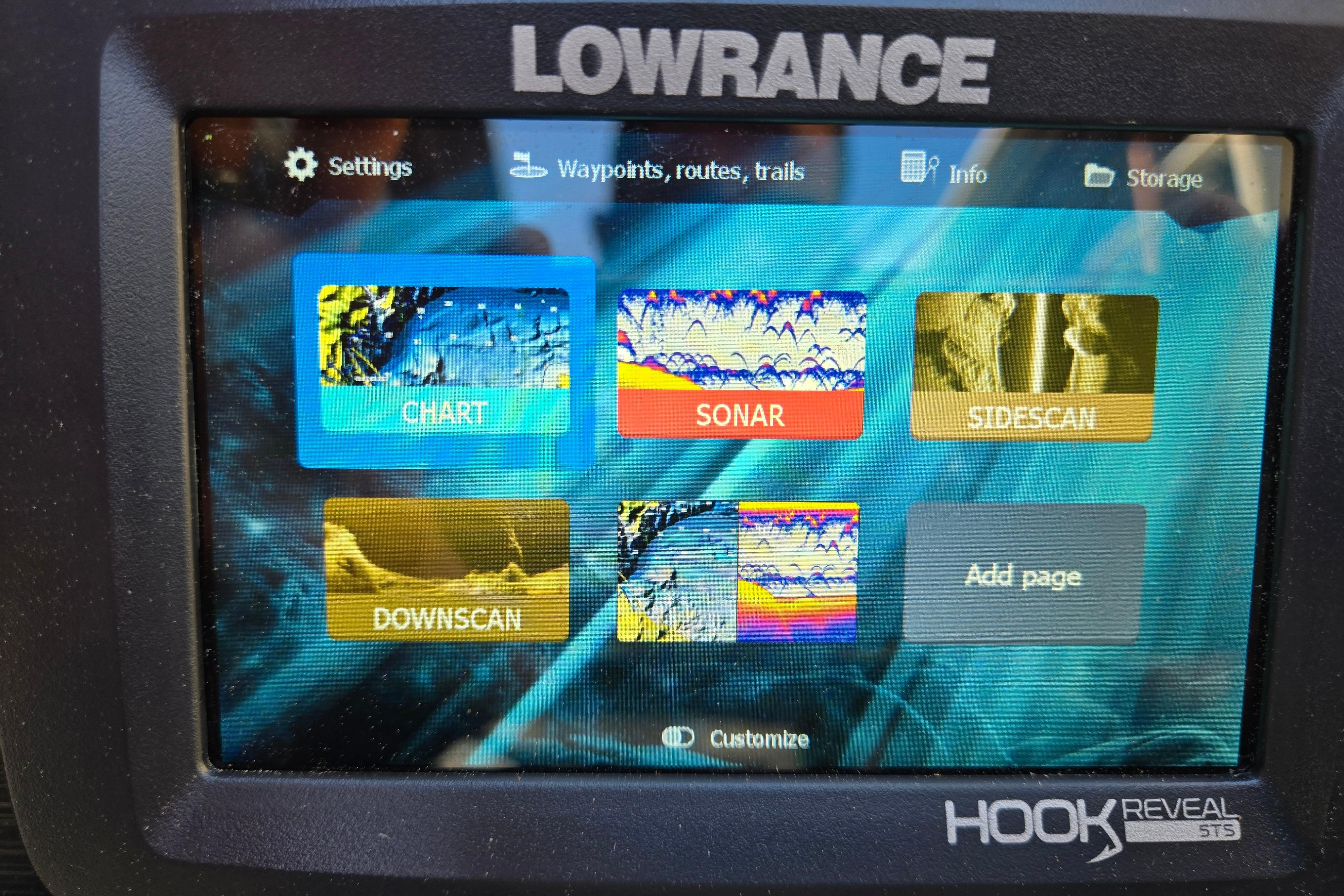 Lowrance Hook Reveal 5TS display on 2024 Godfrey Sweetwater 2486 SB, showing chart, sonar, sidescan options.