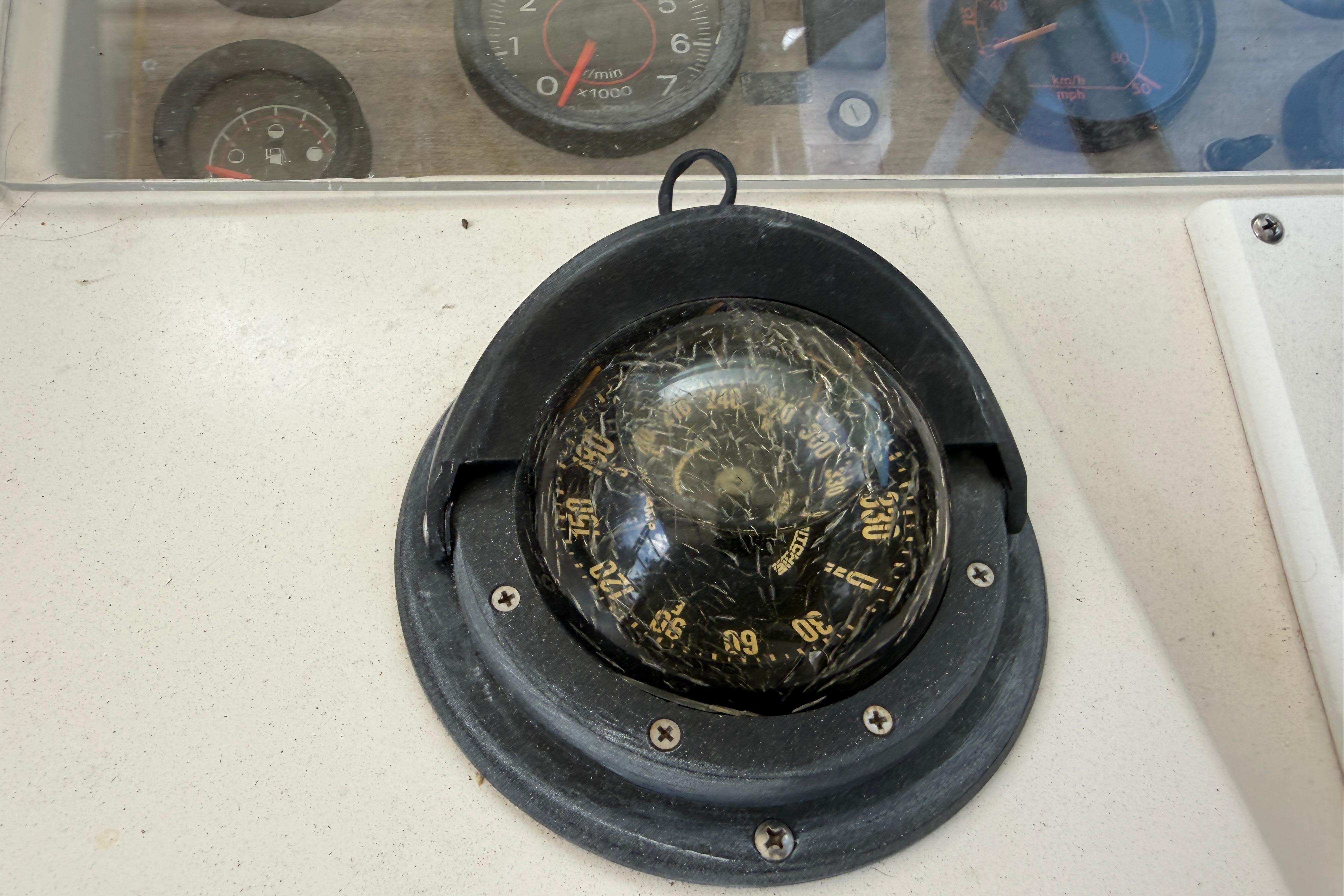 1987 Grady-White Seafarer 226 boat compass and dashboard instruments.