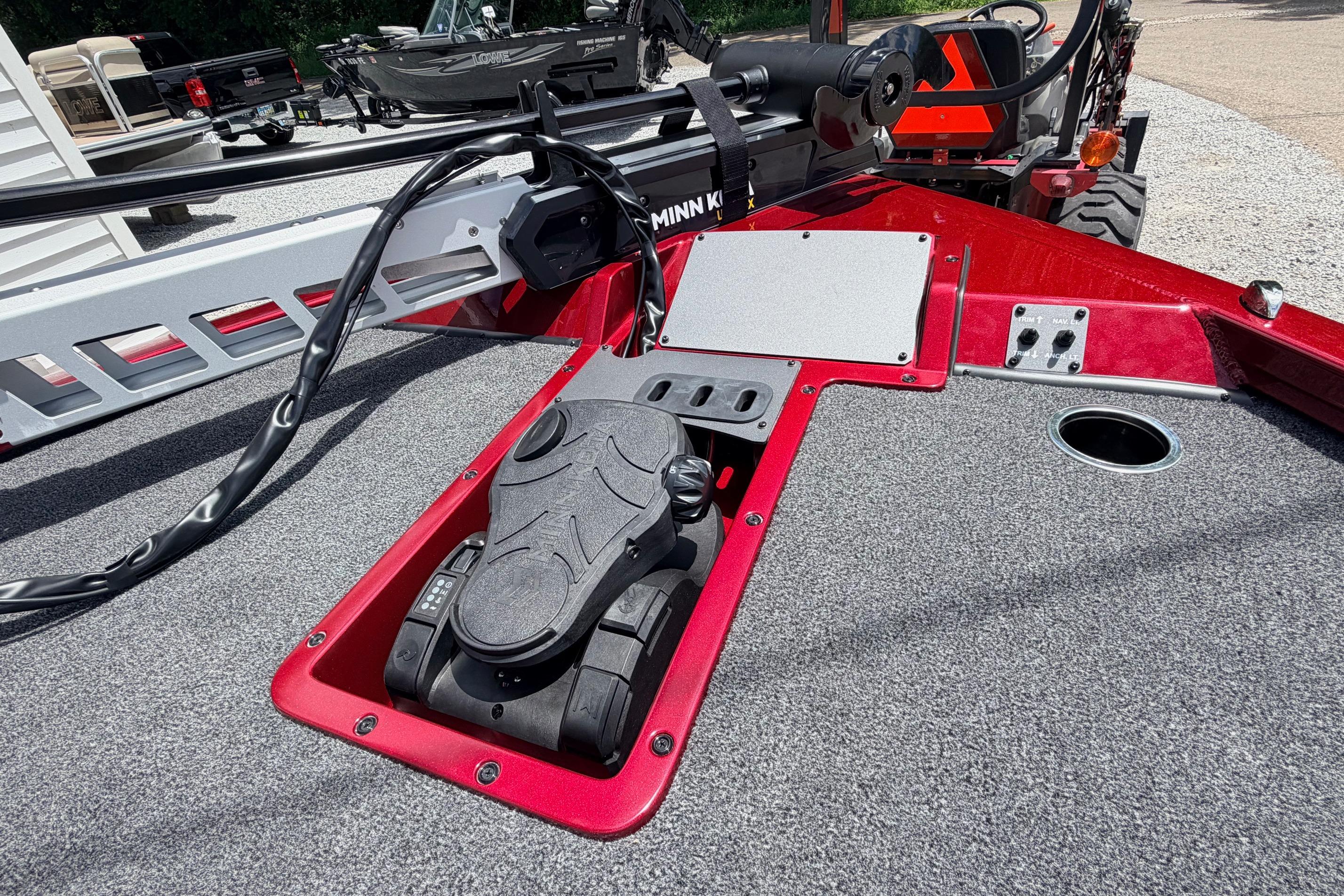 2026 Vexus AVX1985s boat deck with trolling motor pedal and control panel.