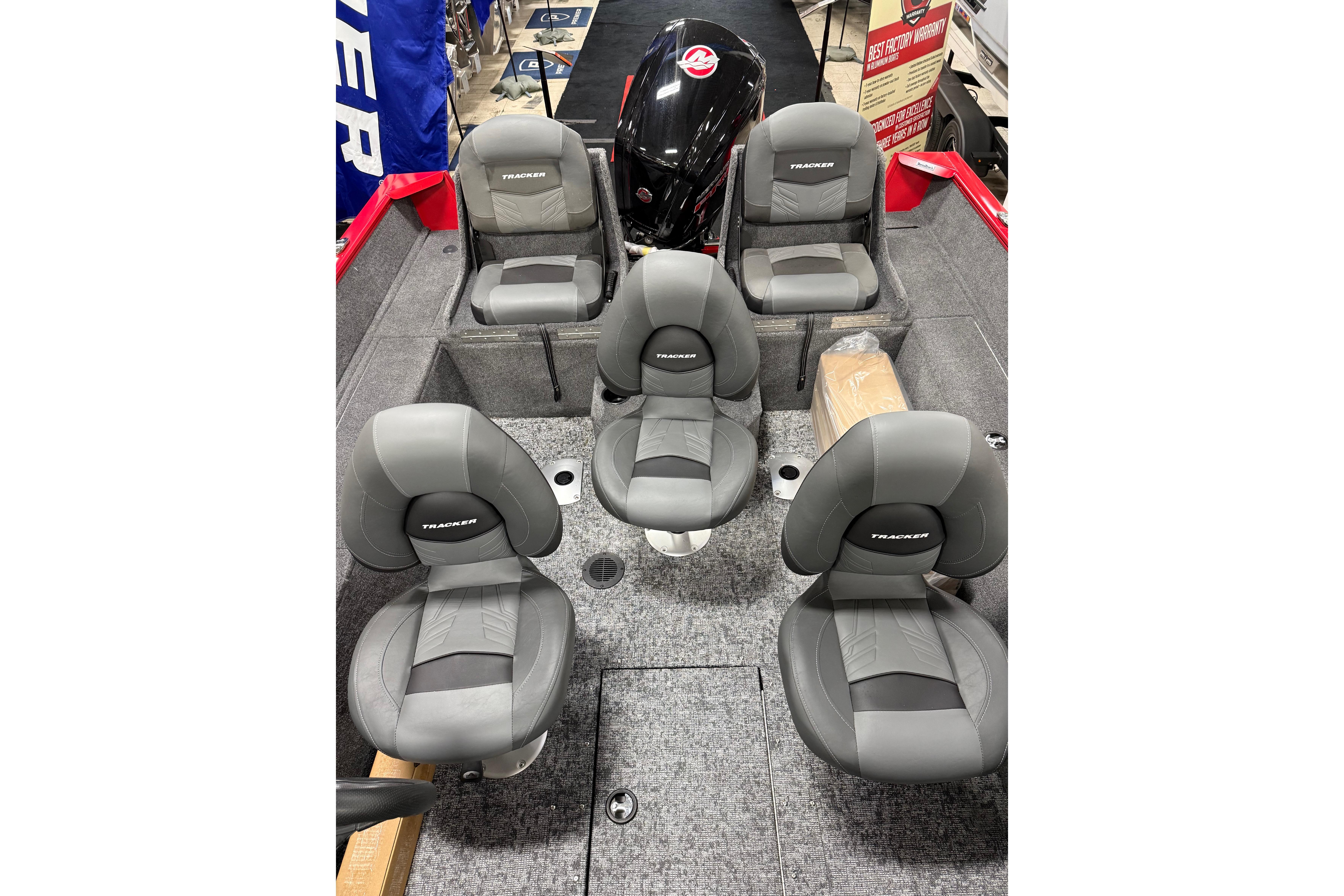 2026 Tracker Pro Guide V-175 Combo boat interior with gray seating and motor.