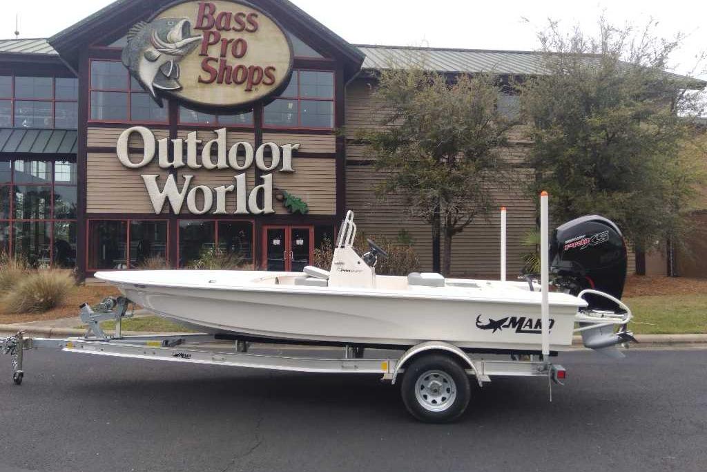 2026 Mako 18 Pro Skiff boat on trailer outside Bass Pro Shops Outdoor World.