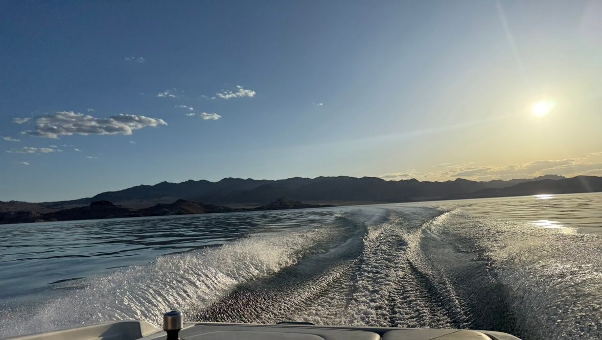 Centurion Avalanche boat on calm water at sunset, 2003 model.