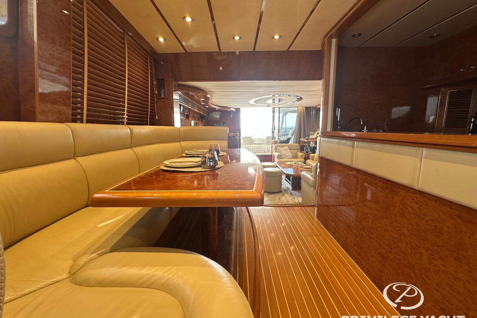 Luxurious interior of a 2006 Monte Fino 76 yacht with elegant dining area.