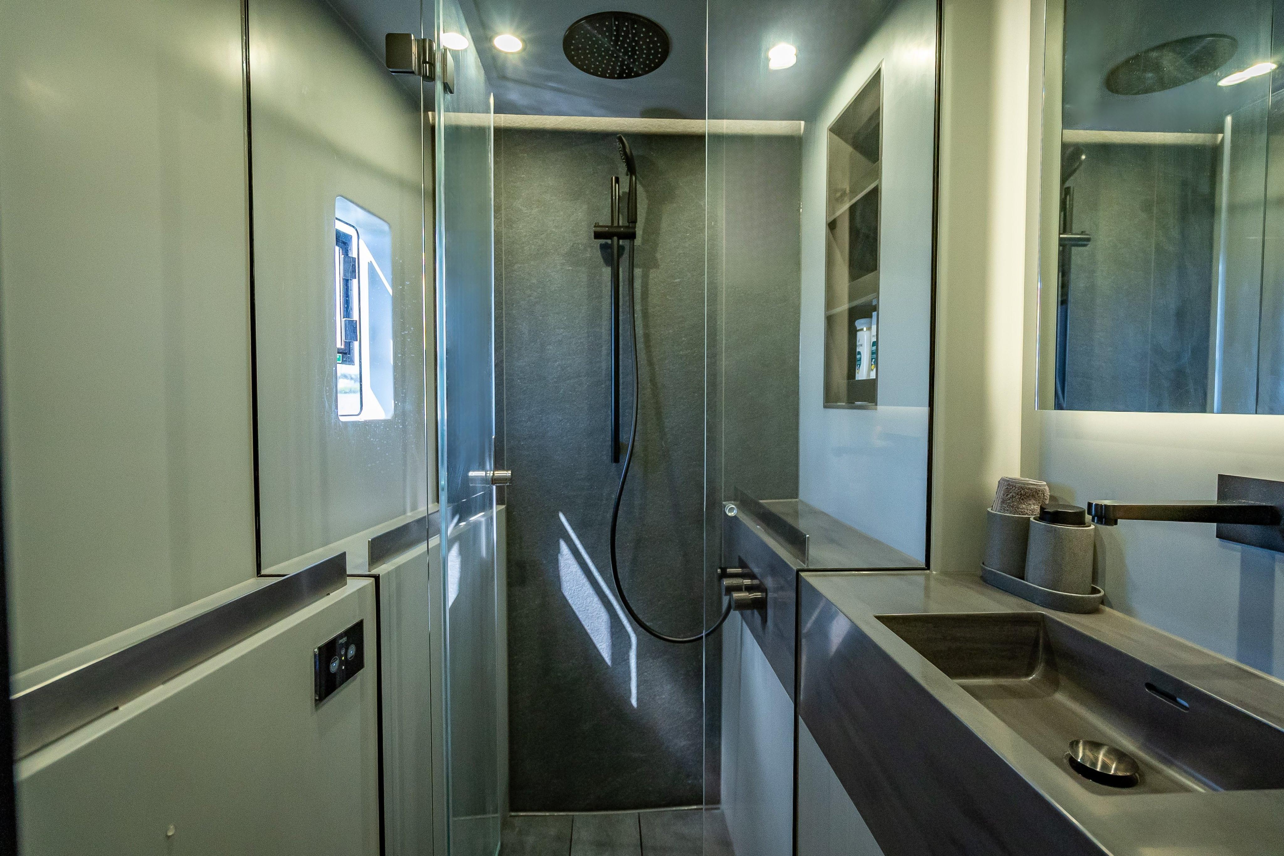 Modern bathroom interior on 2026 Sunreef 60 Power yacht, featuring sleek design and fixtures.