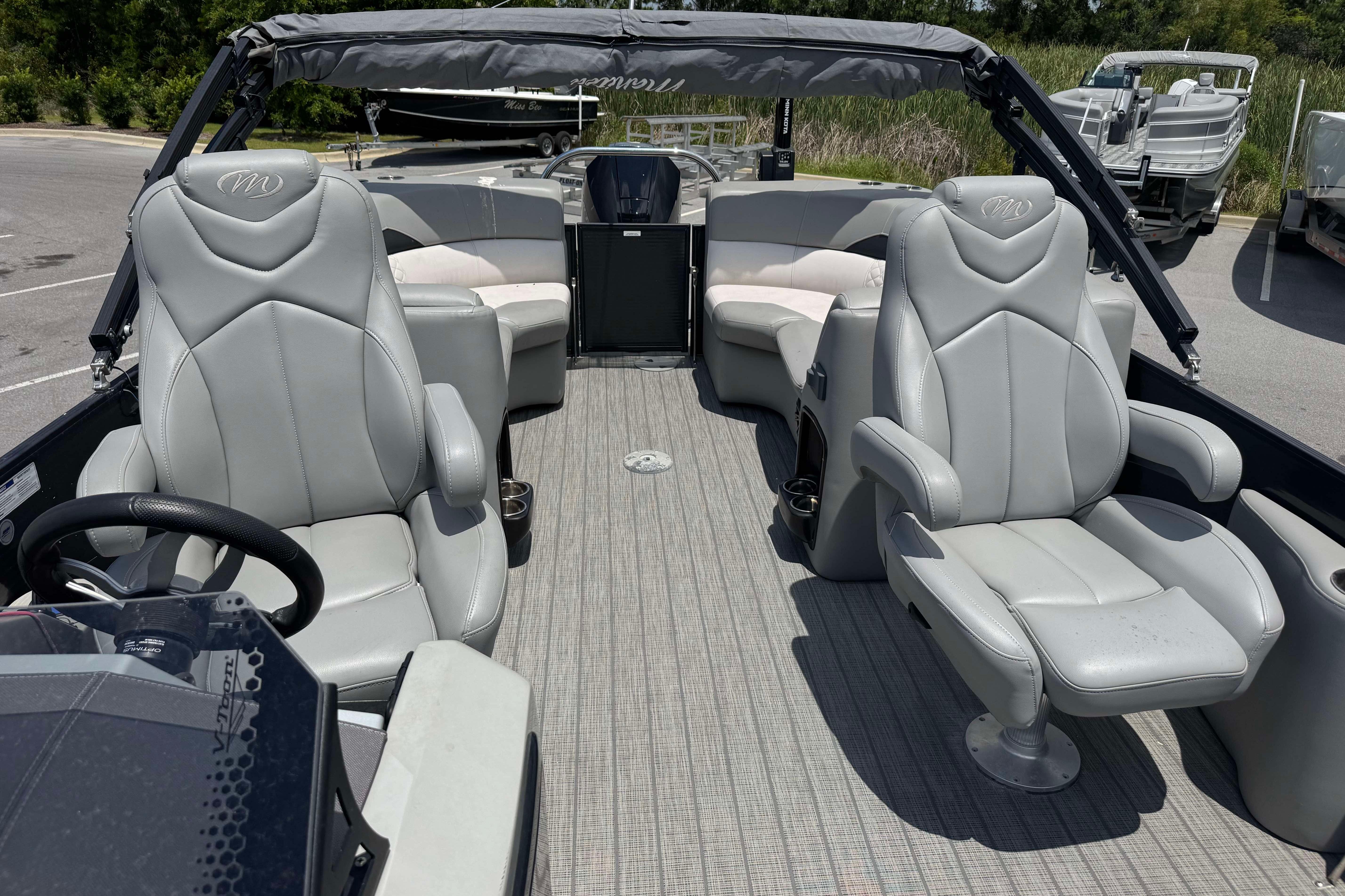 2022 Manitou 25 Encore pontoon boat interior with luxurious seating and modern design.