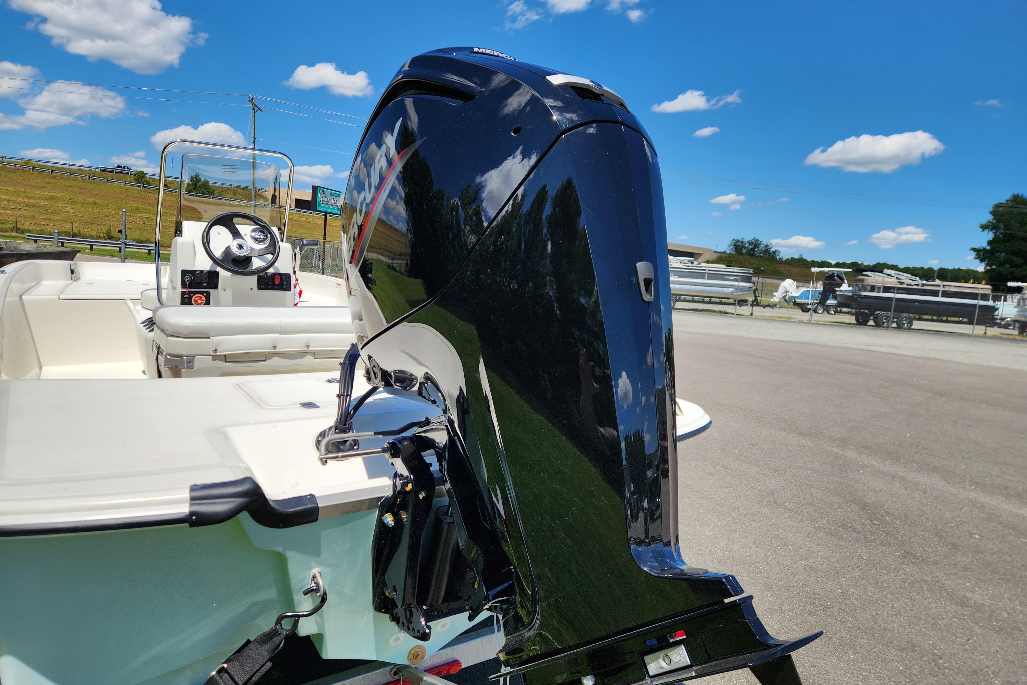 2026 Mako Pro Skiff 17 CC with powerful outboard motor under clear blue sky.