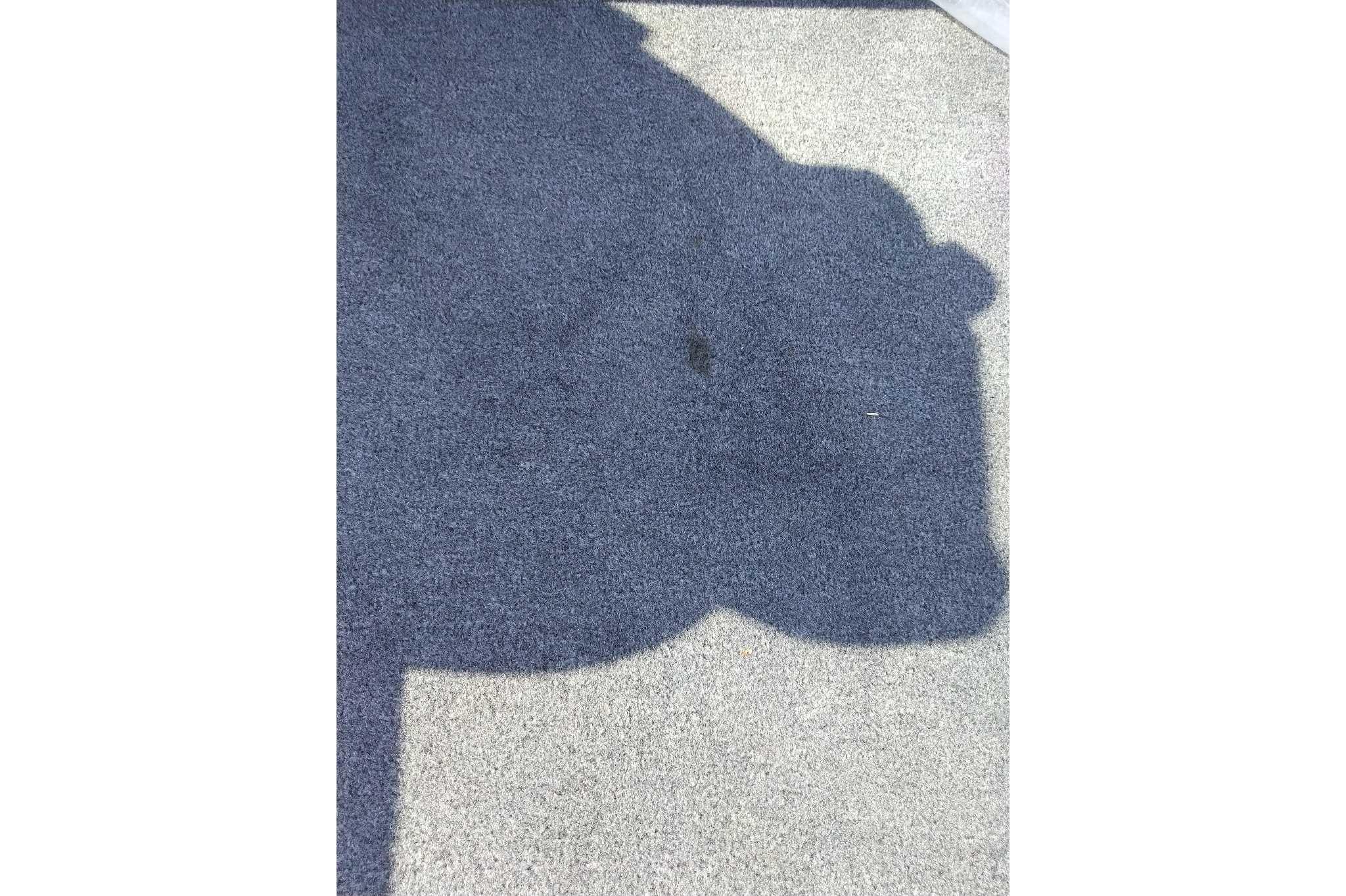 Shadow on carpeted floor of 2026 Tracker Bass Tracker Classic XL boat.