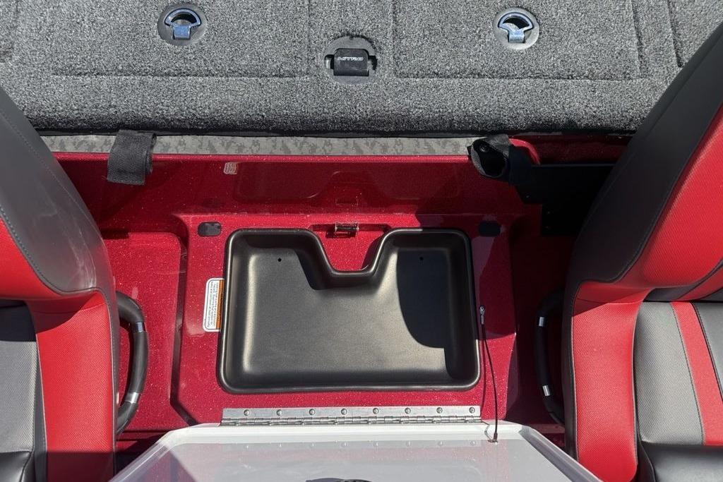 Interior view of 2026 Nitro Z20 XL Pro boat, featuring red and black seating and storage compartments.
