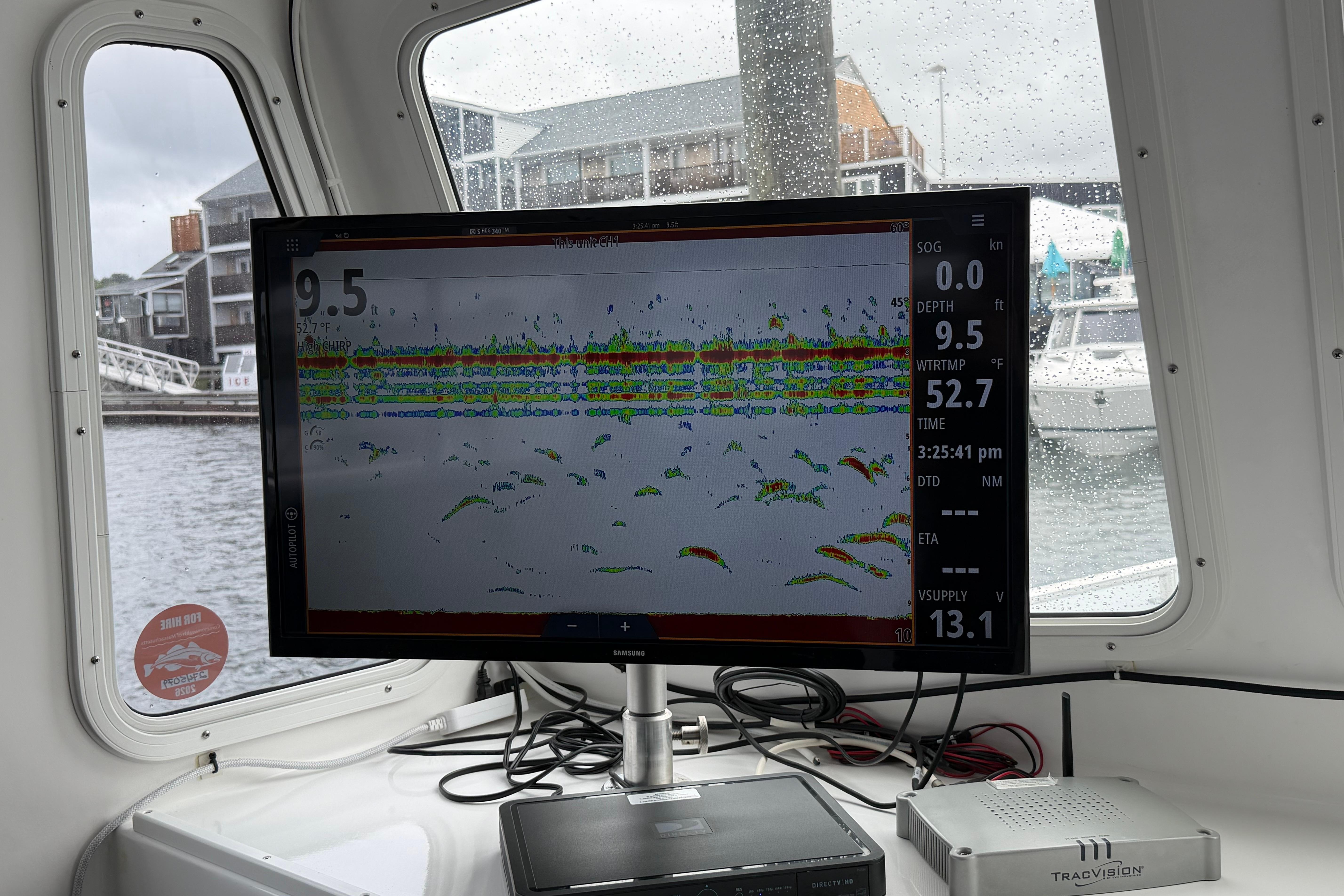 Fishfinder display on 2018 H&H Marine Osmond Beal boat, showing depth and water temperature.