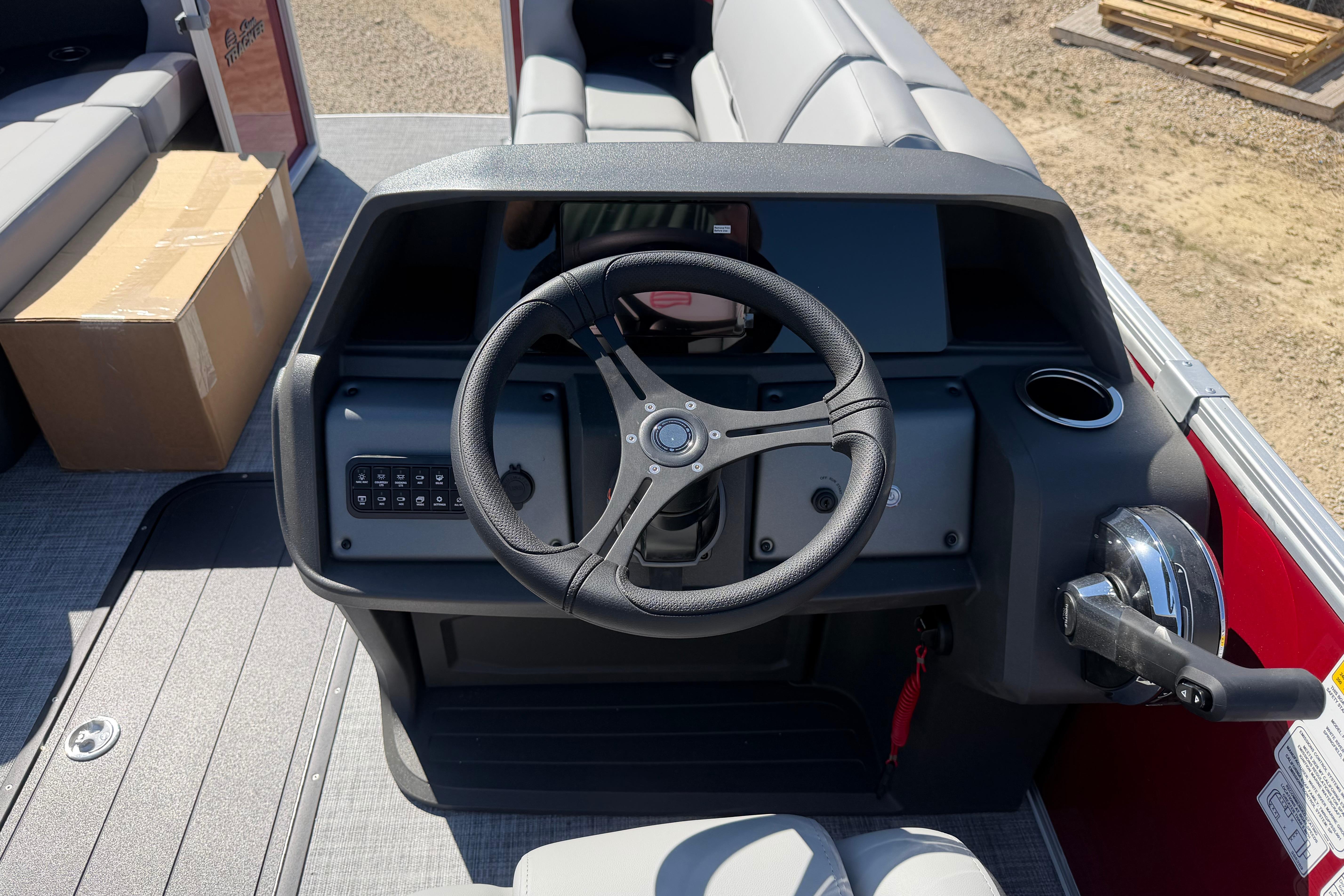 2026 Sun Tracker Party Barge 22 RF XP3 steering console with controls and seating.