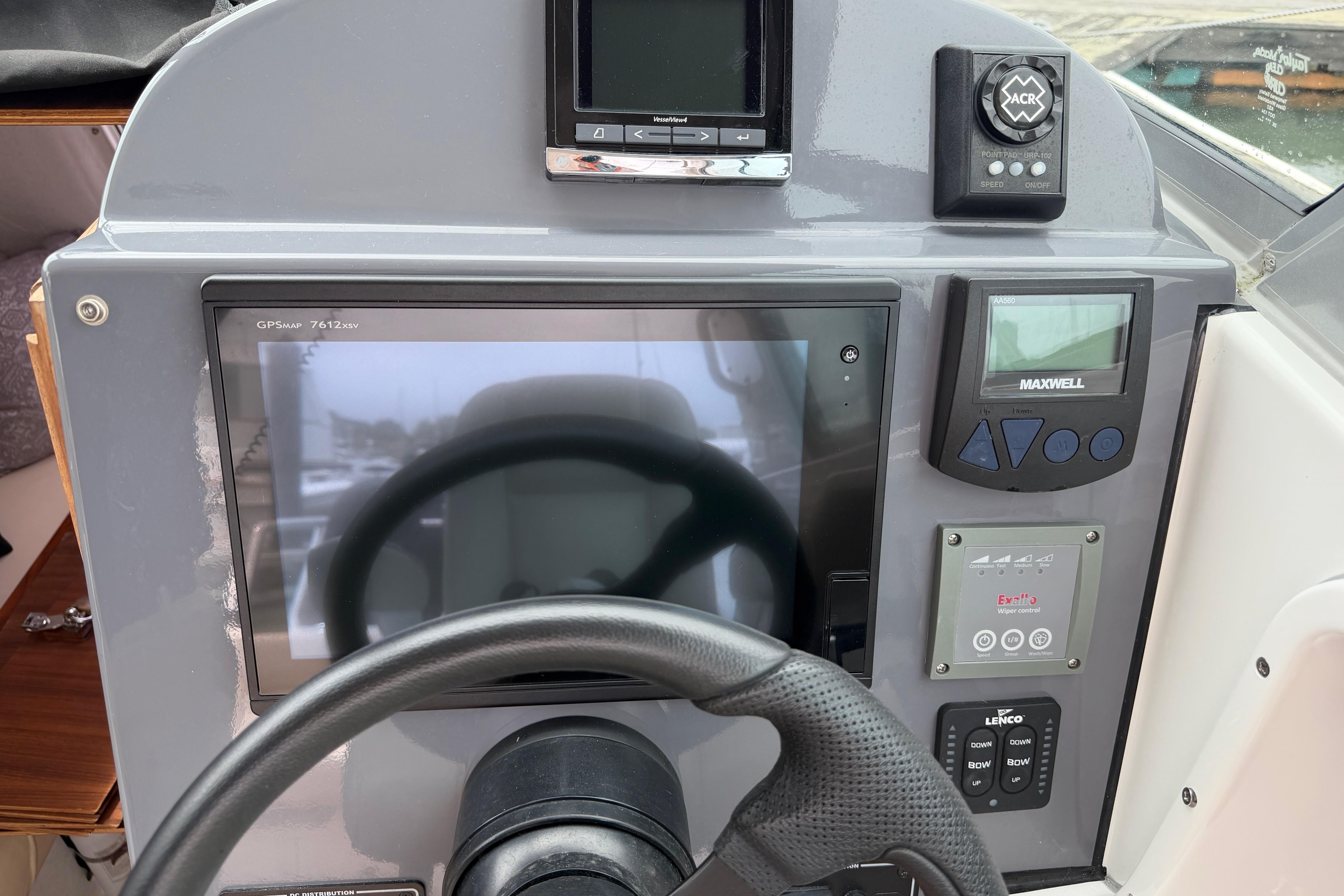 Control panel of a 2016 Protector Targa 30 boat with navigation and steering equipment.