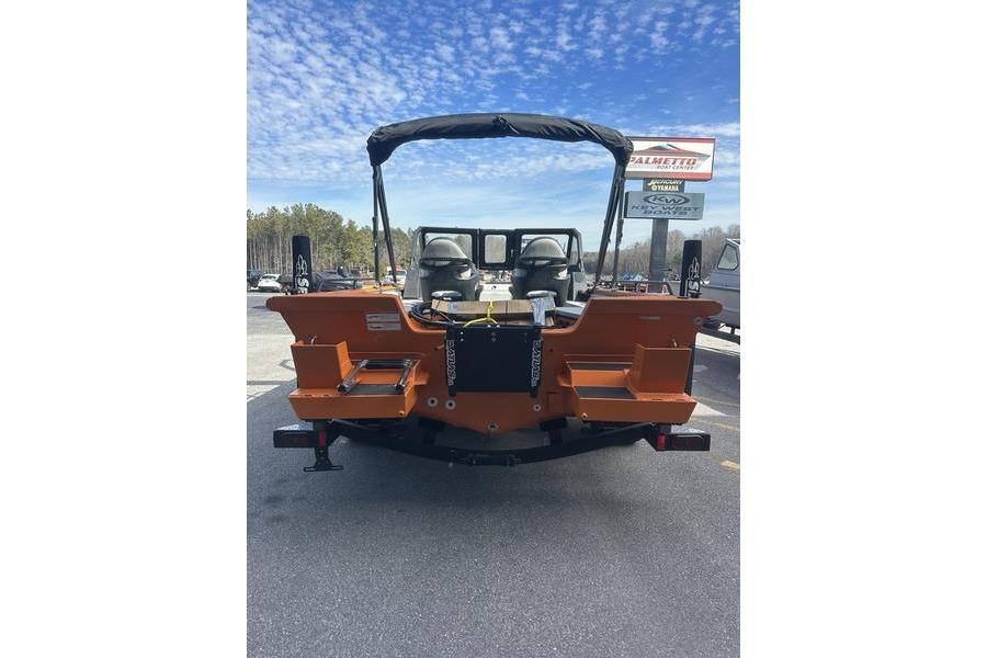 2026 SeaArk ProCat 240 boat, rear view, orange color, parked outdoors under a blue sky.