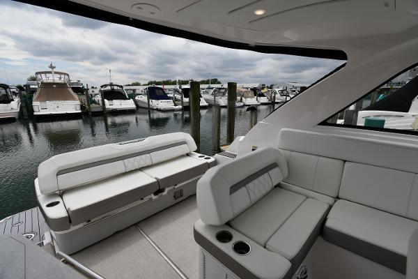 2021 Regal 35 Sport Coupe interior with luxurious seating, docked at a marina.