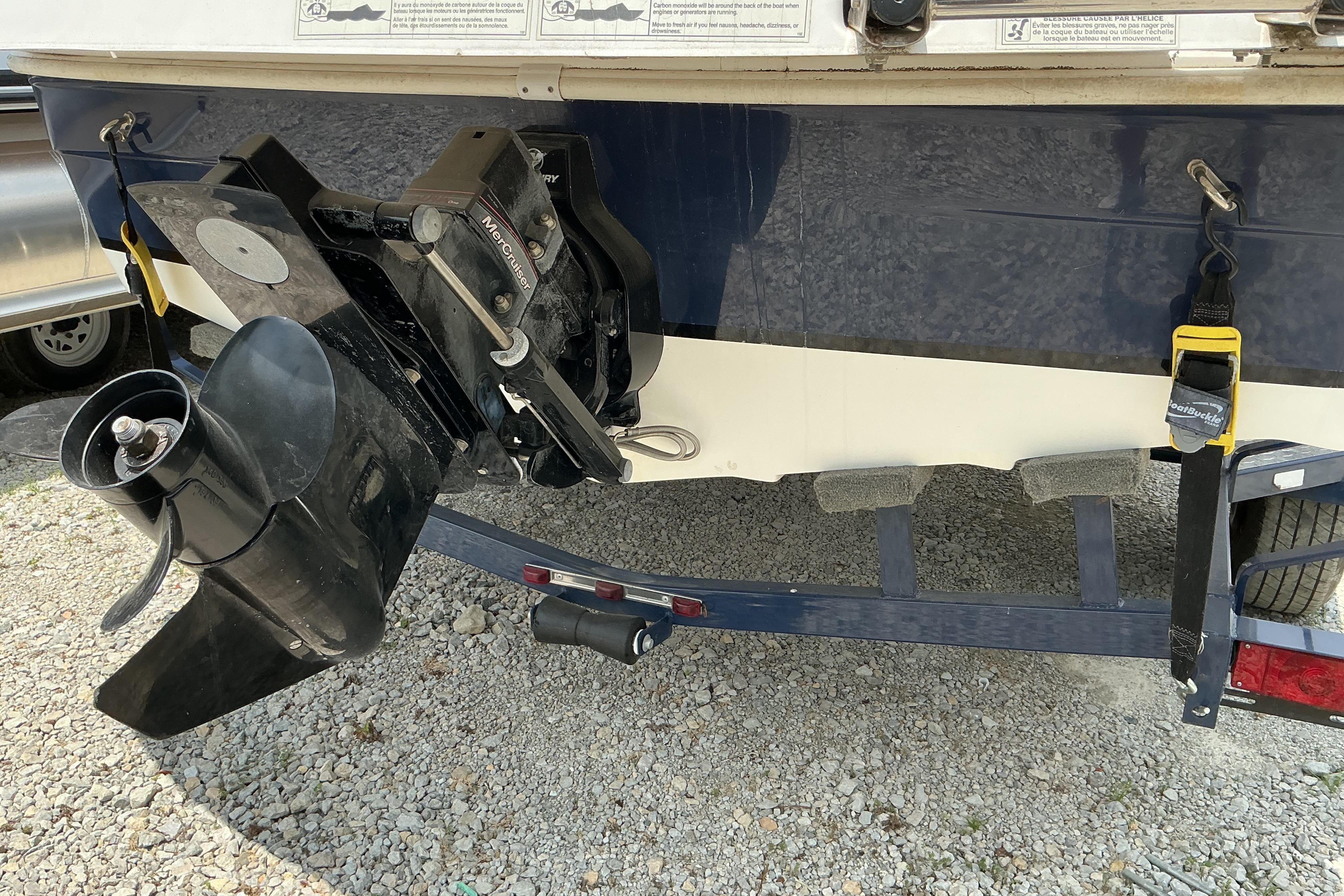 Rear view of a 2015 Hurricane SunDeck 187 IO boat on a trailer.