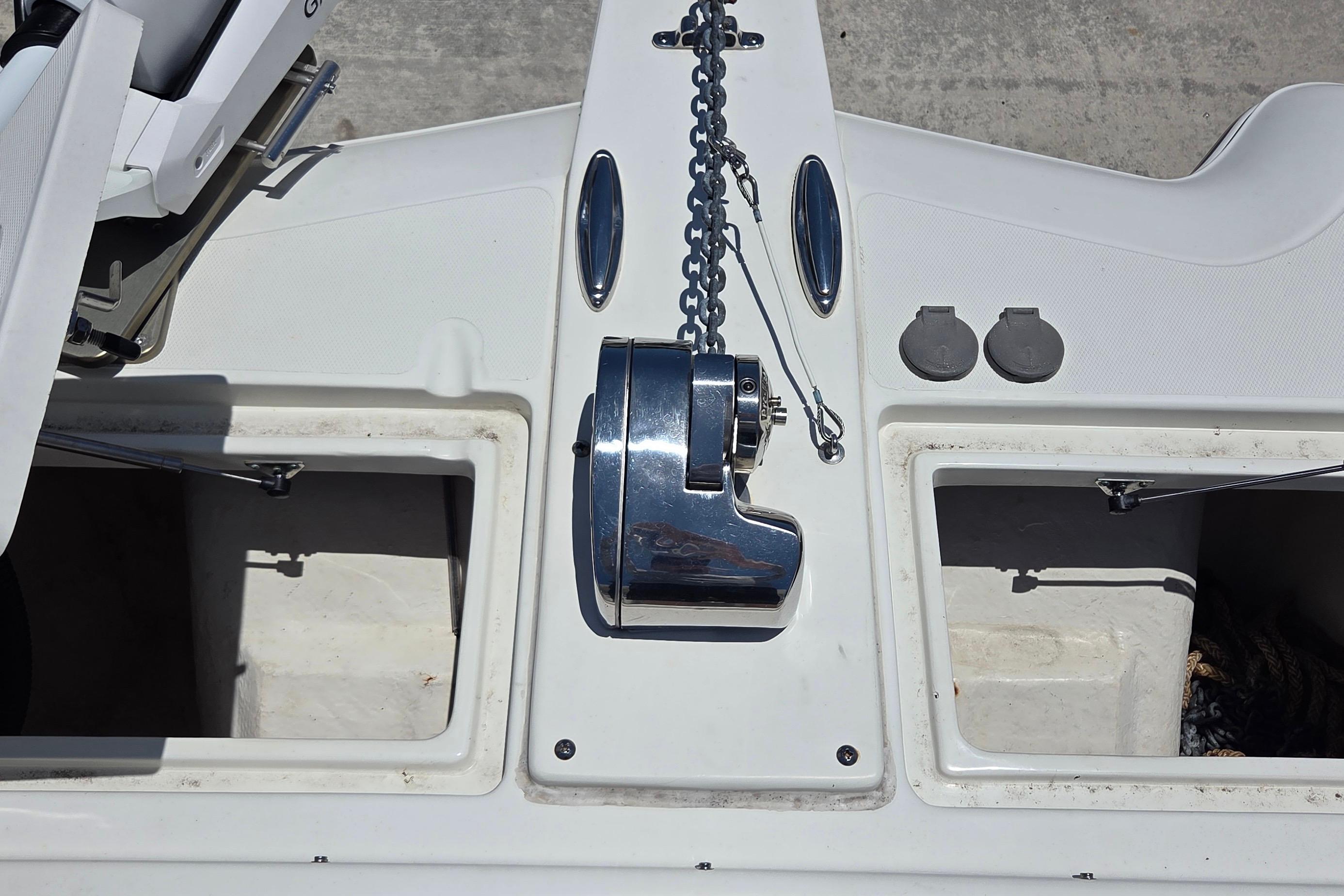 2022 World Cat 255 DC boat anchor system with storage compartments.