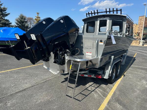 2024 Spartan 260 Maximus Pro XL boat on trailer with dual outboard motors.