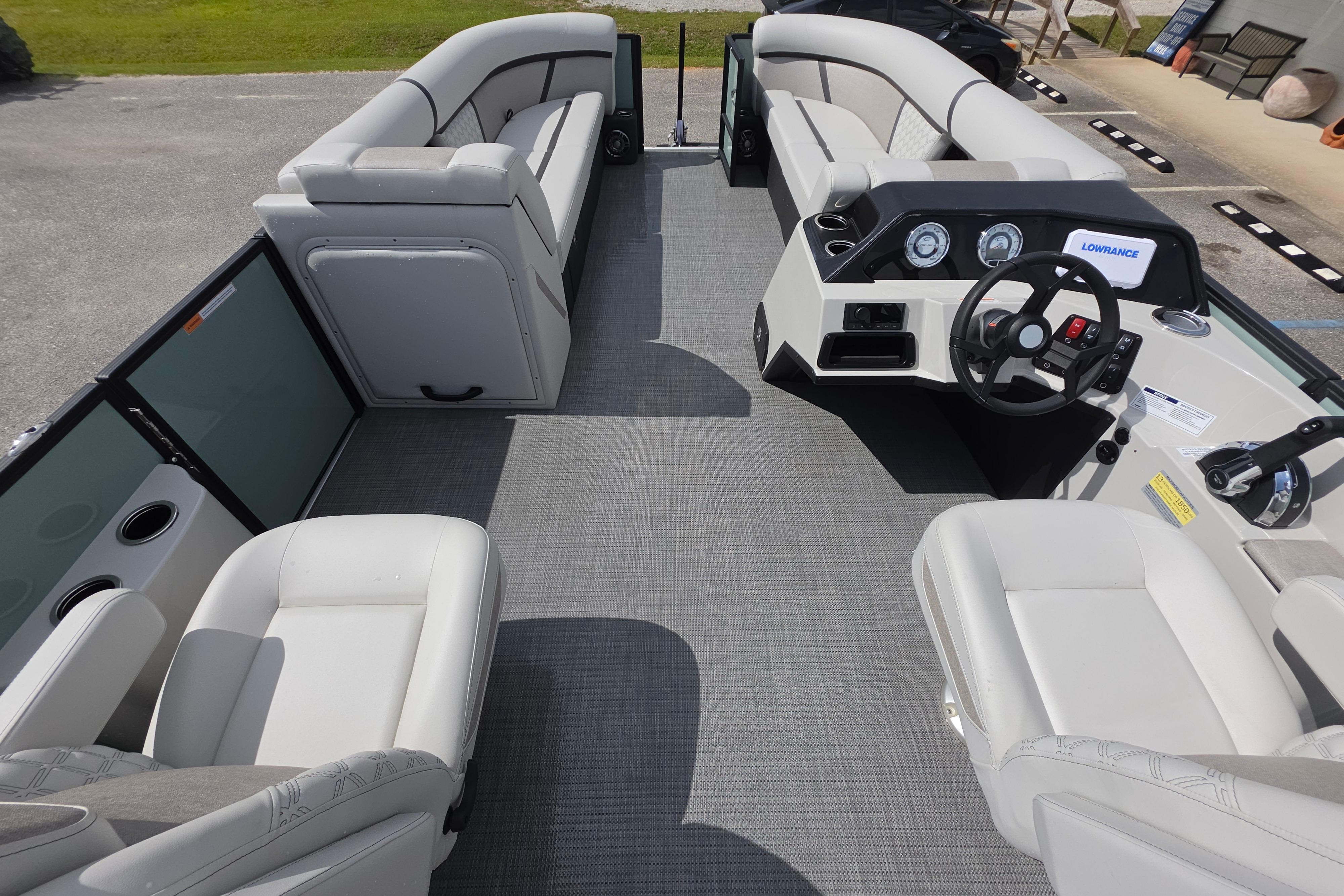 2026 Crest 235 Conquest SLC pontoon boat interior with modern seating and helm.