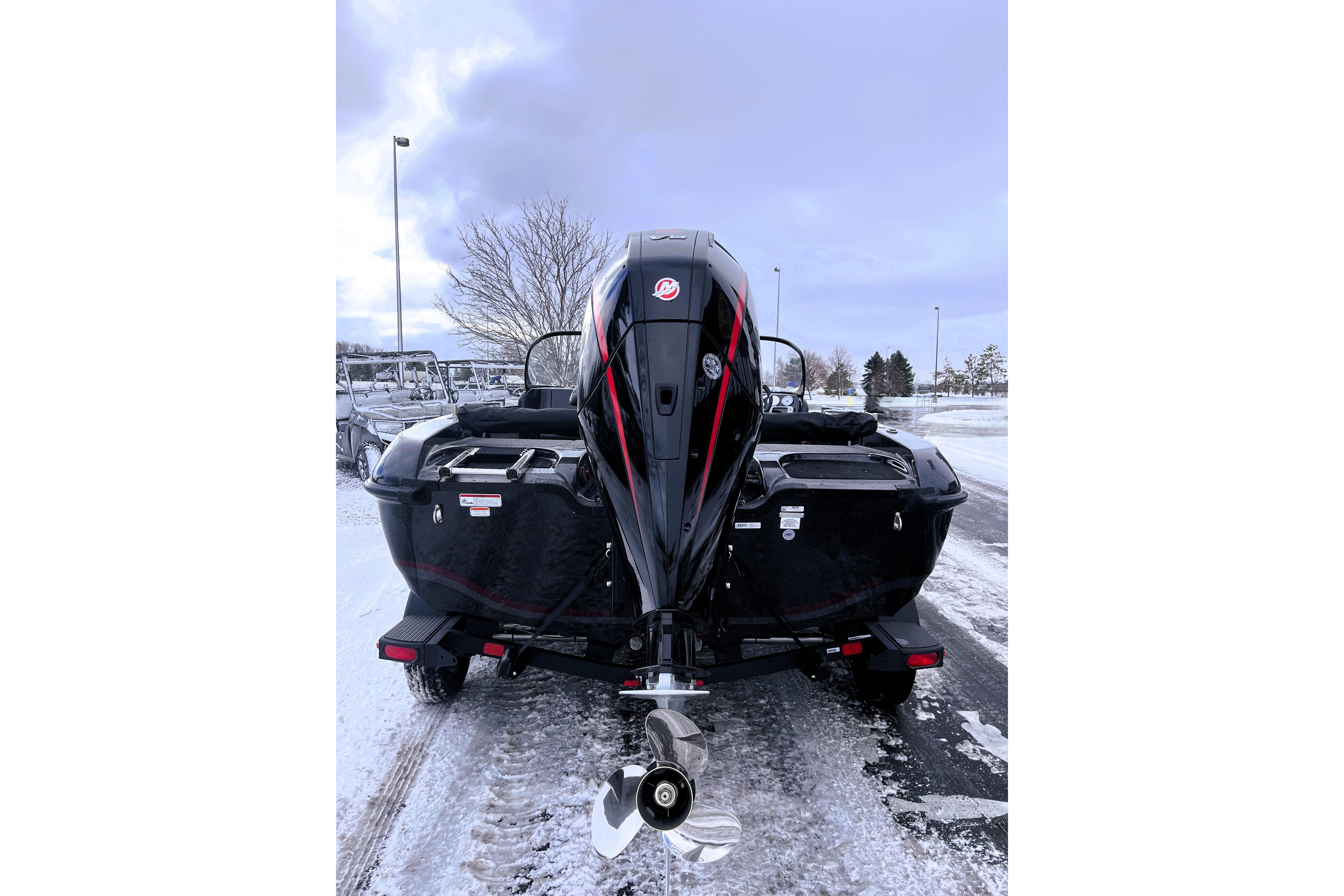 2026 Nitro ZV19 Sport Pro boat on snowy ground, rear view.