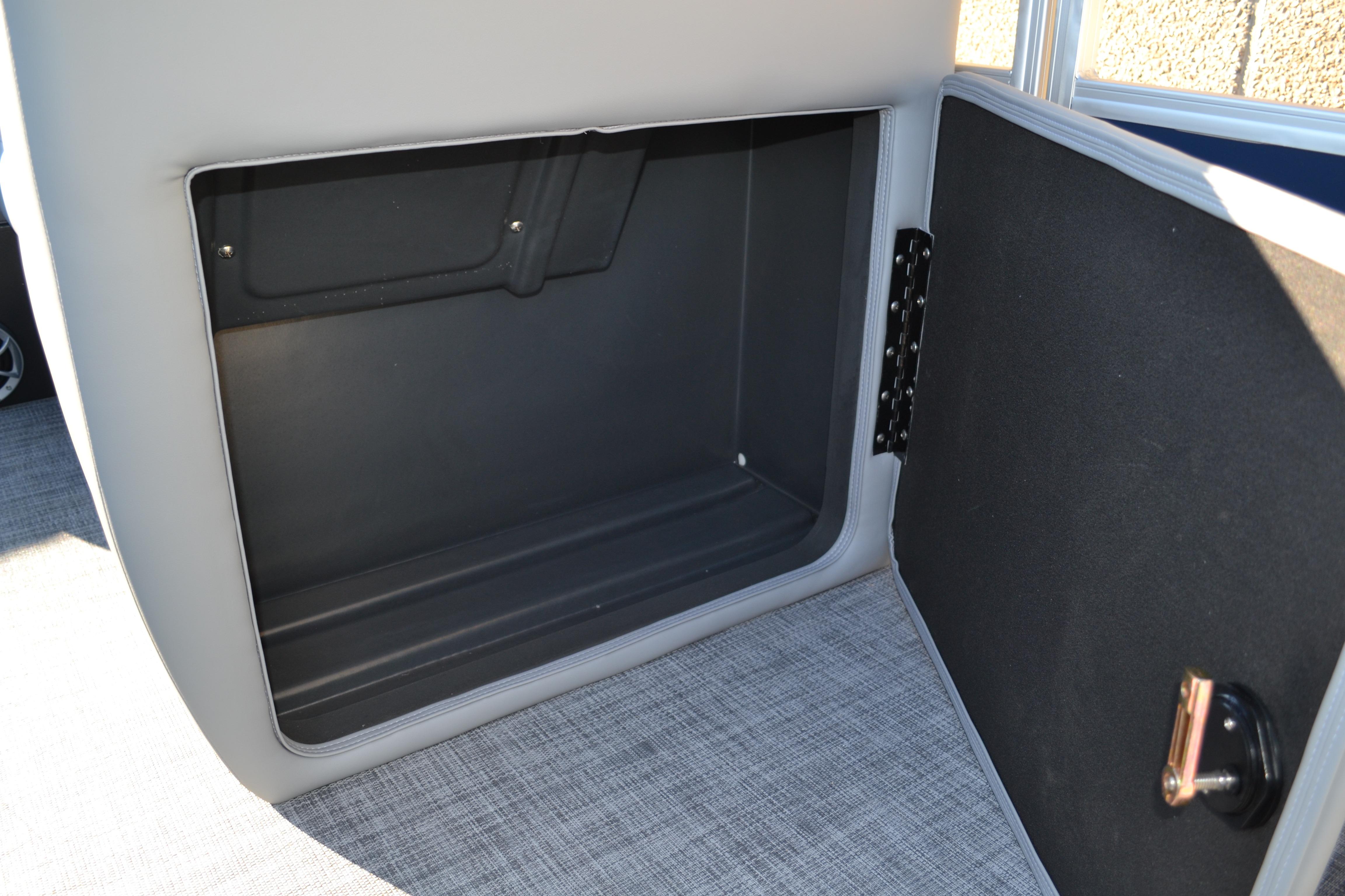 Open storage compartment in 2026 Sun Tracker SportFish 22 XP3 boat.