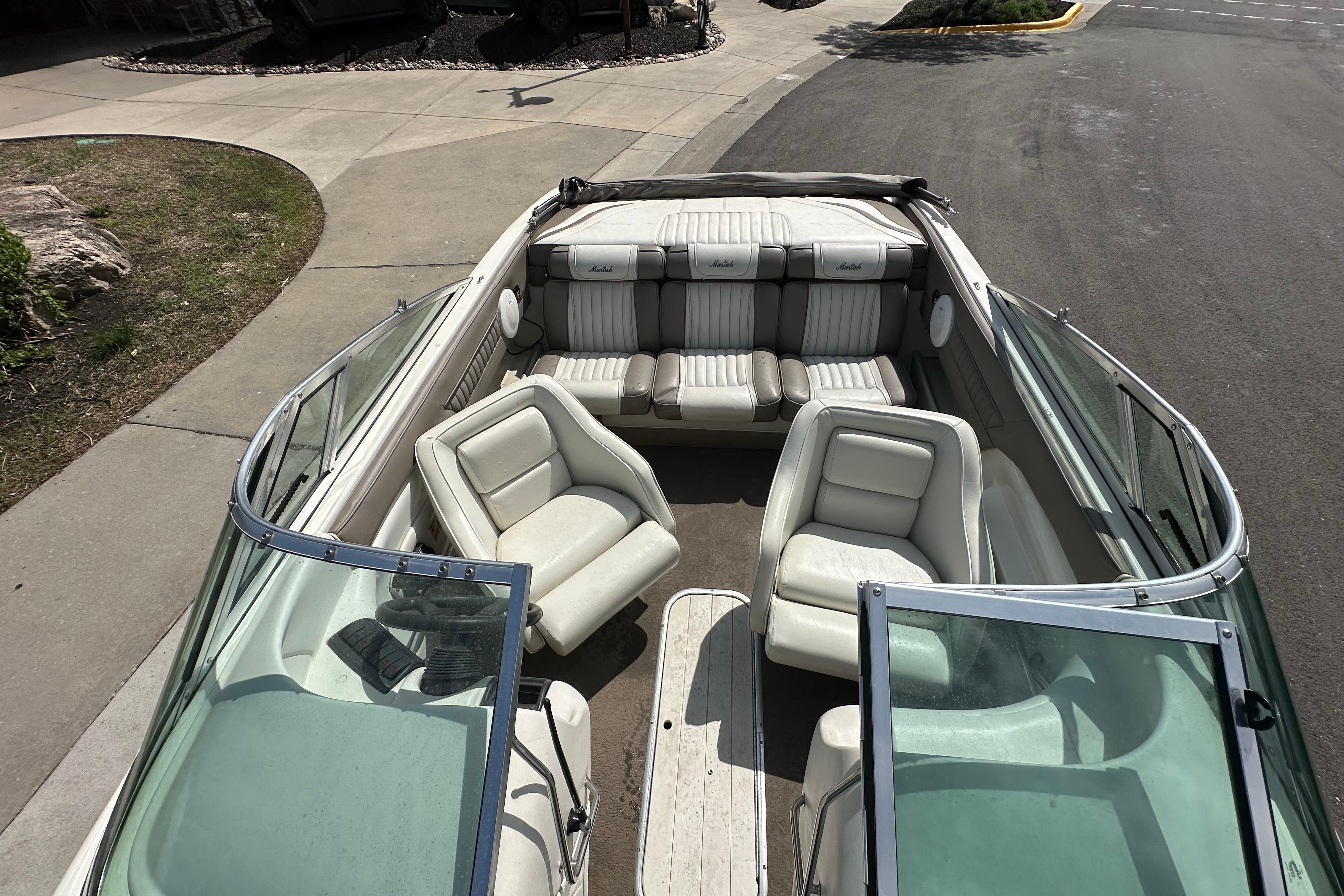1995 Mariah 180 Shabah boat interior with white seating and open deck layout.