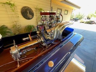 A 1980 Sanger HYDRO V DRIVE with a powerful engine, parked in a driveway.