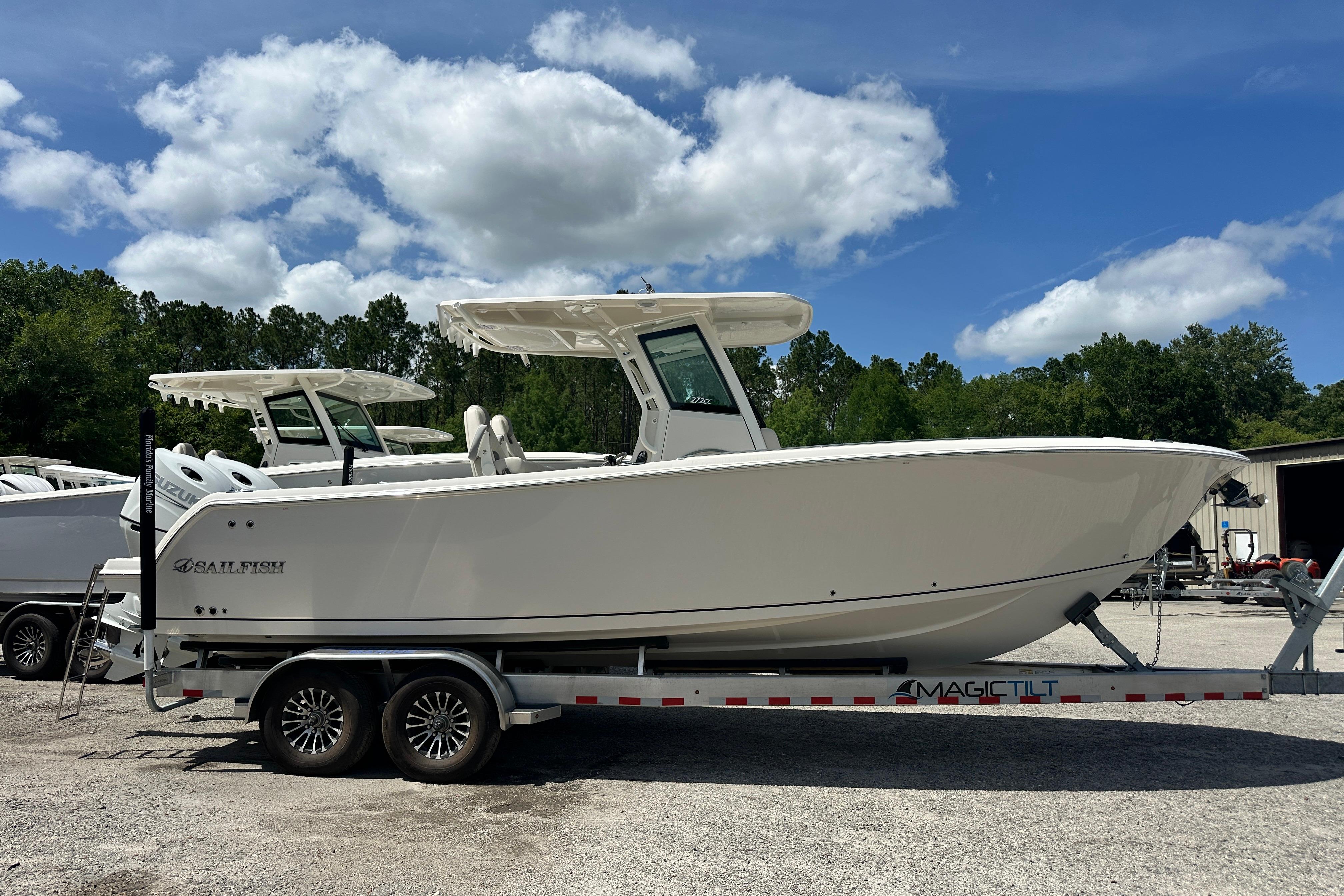 2026 Sailfish 272 CC boat on trailer under blue sky.