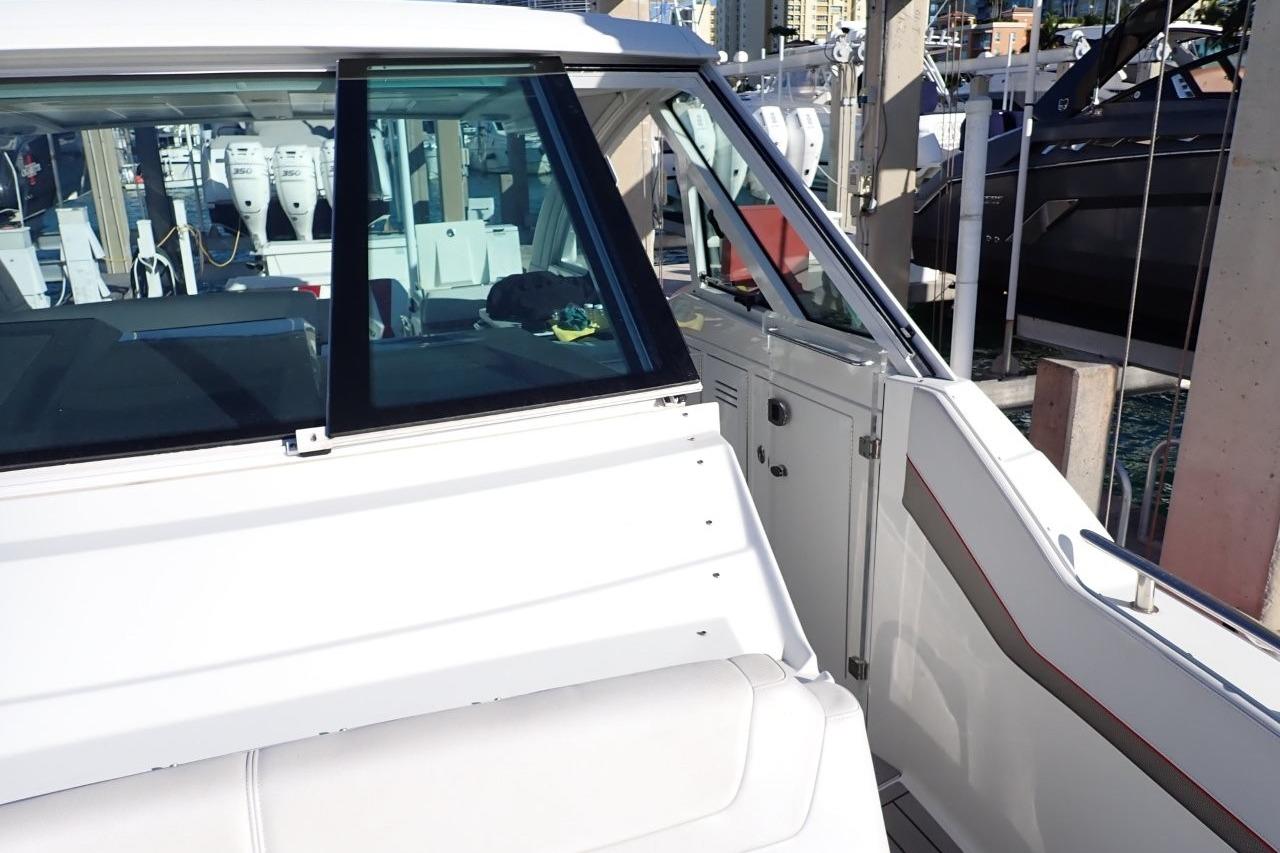 2023 Formula 380 Super Sport Crossover OB at marina, showcasing sleek design and modern features.