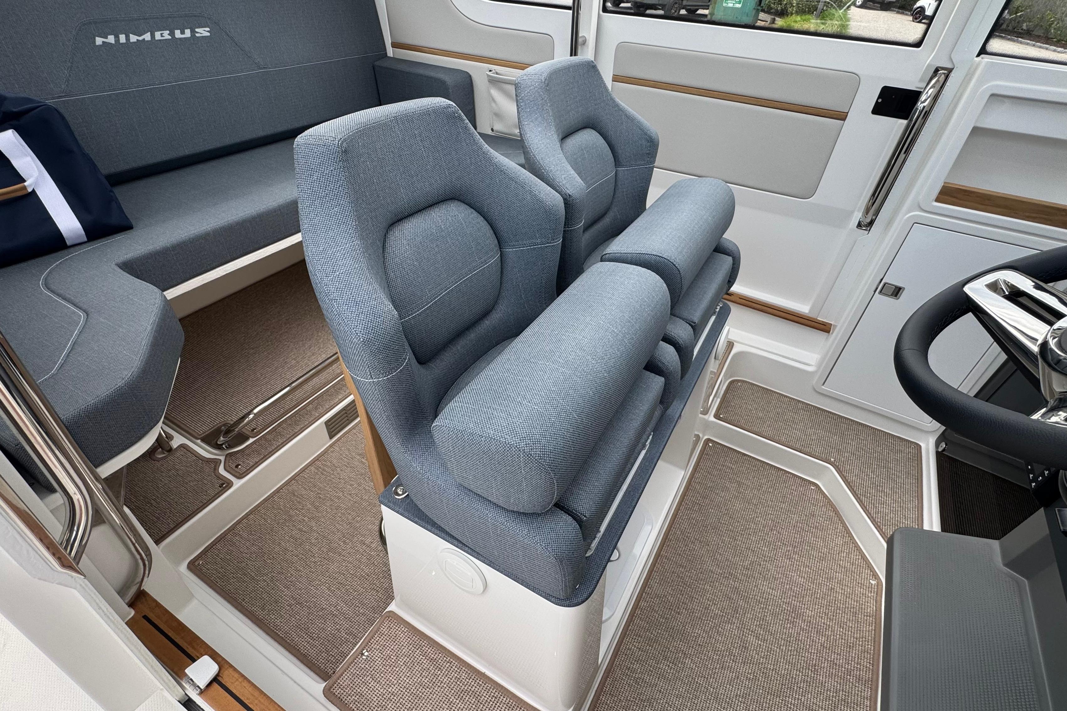 Interior of the Nimbus Commuter 9 with gray seats and modern design.