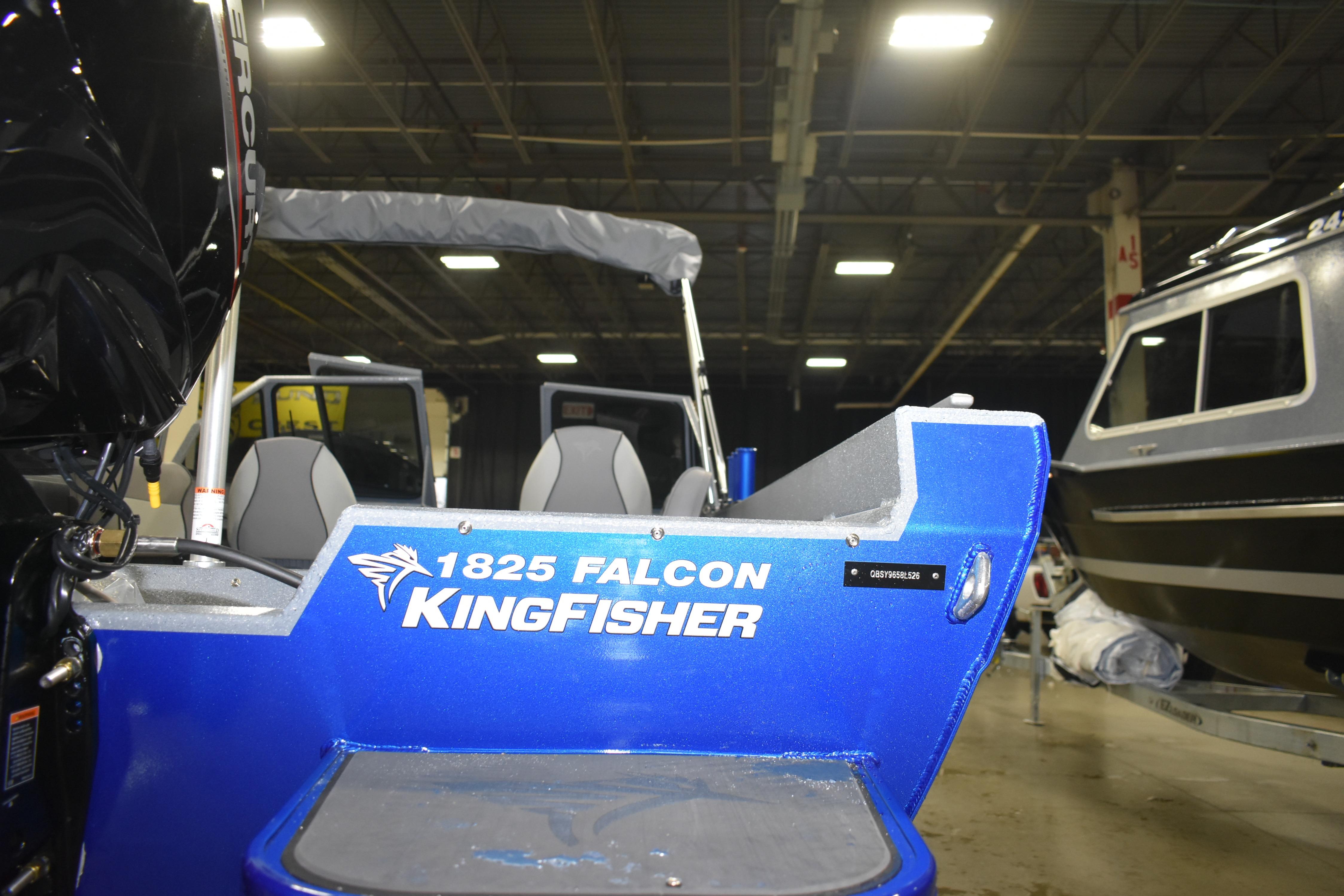 Blue 2026 KingFisher 1825 Falcon boat displayed indoors with visible seating.