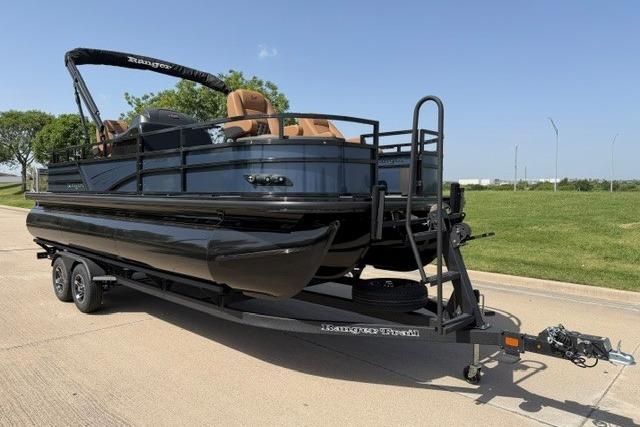 2026 Ranger 223F pontoon boat on trailer, parked on a sunny day.