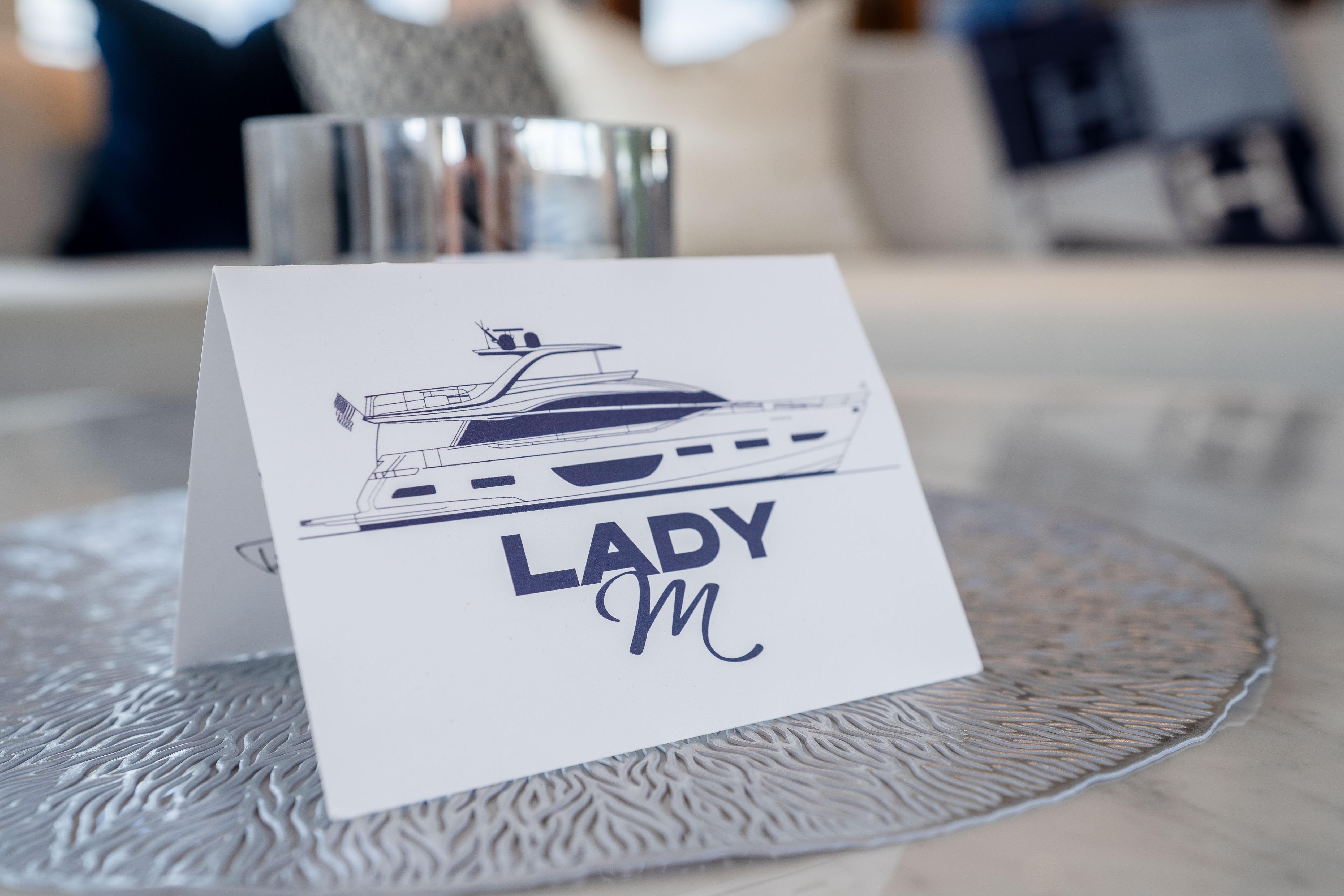 Elegant card featuring yacht illustration, labeled 'Lady M', on textured surface, Princess Y85 2020.