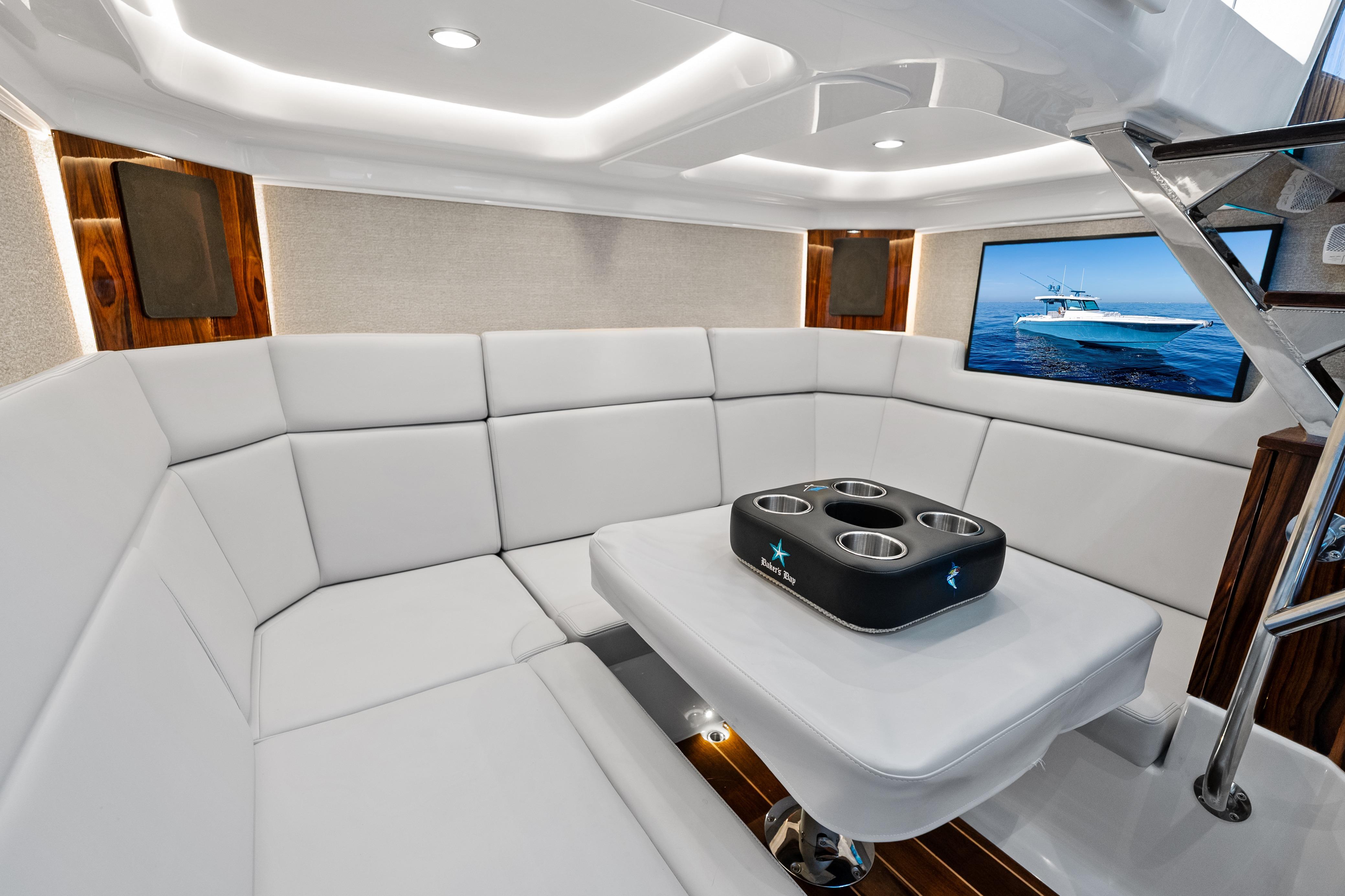Luxurious interior of 2025 HCB 56 Suenos GIX yacht with plush seating and modern decor.