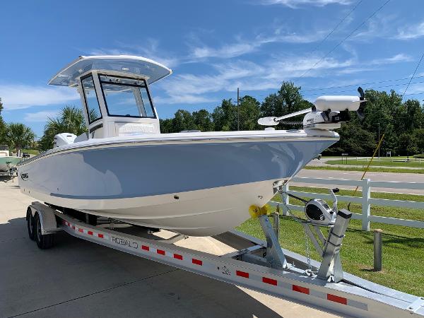 2024 Robalo 266 Cayman boat on a trailer, ready for transport.