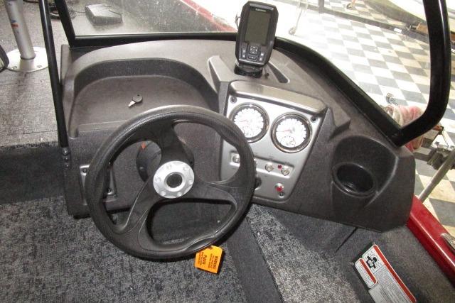 2024 Tracker Pro Guide V-16 WT boat dashboard with steering wheel and gauges.