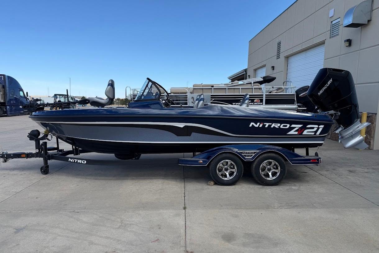 2026 Nitro ZV21 Pro boat on trailer, parked outdoors near a building.