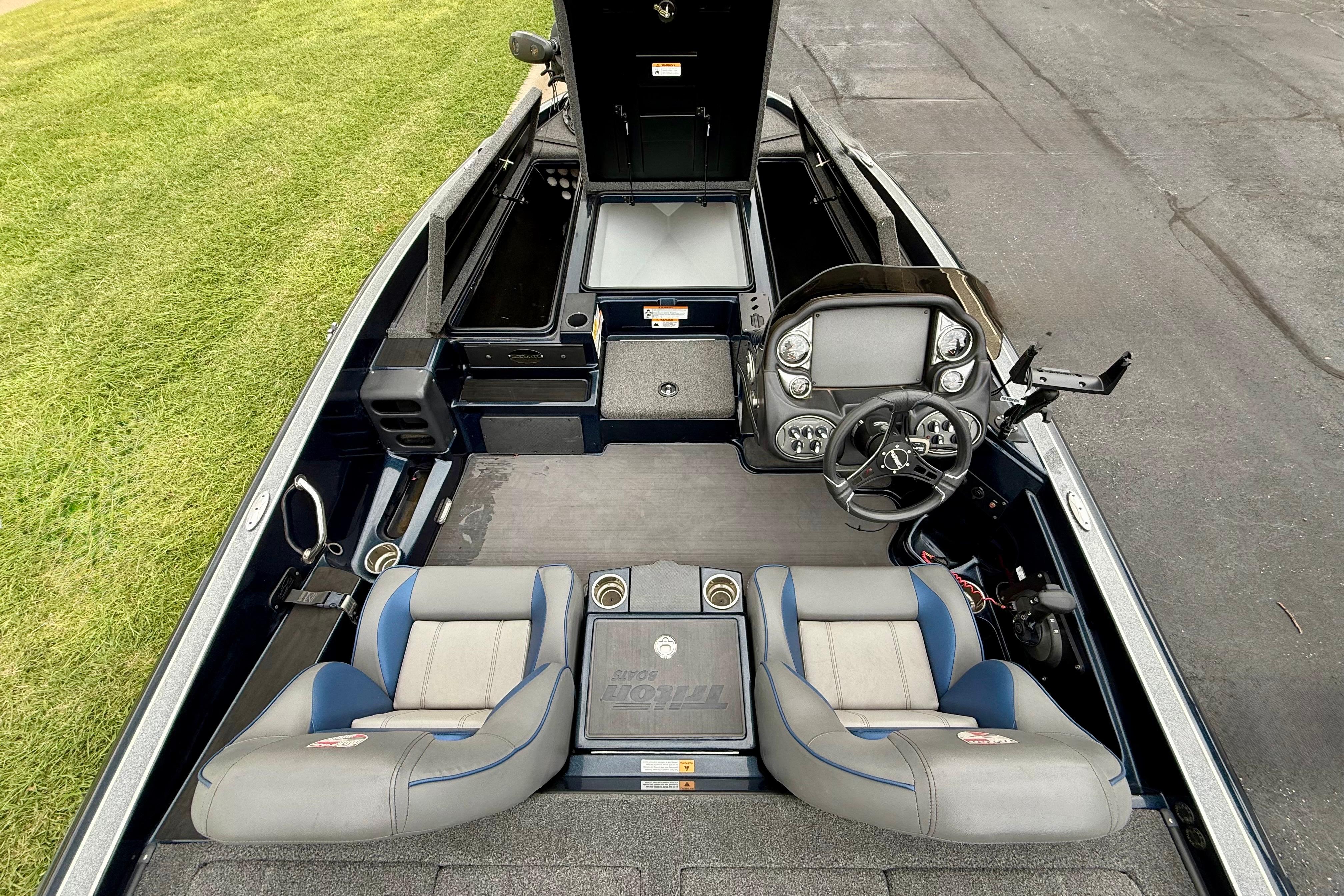 2023 Triton 18 TrX boat interior with dual seats and modern dashboard.