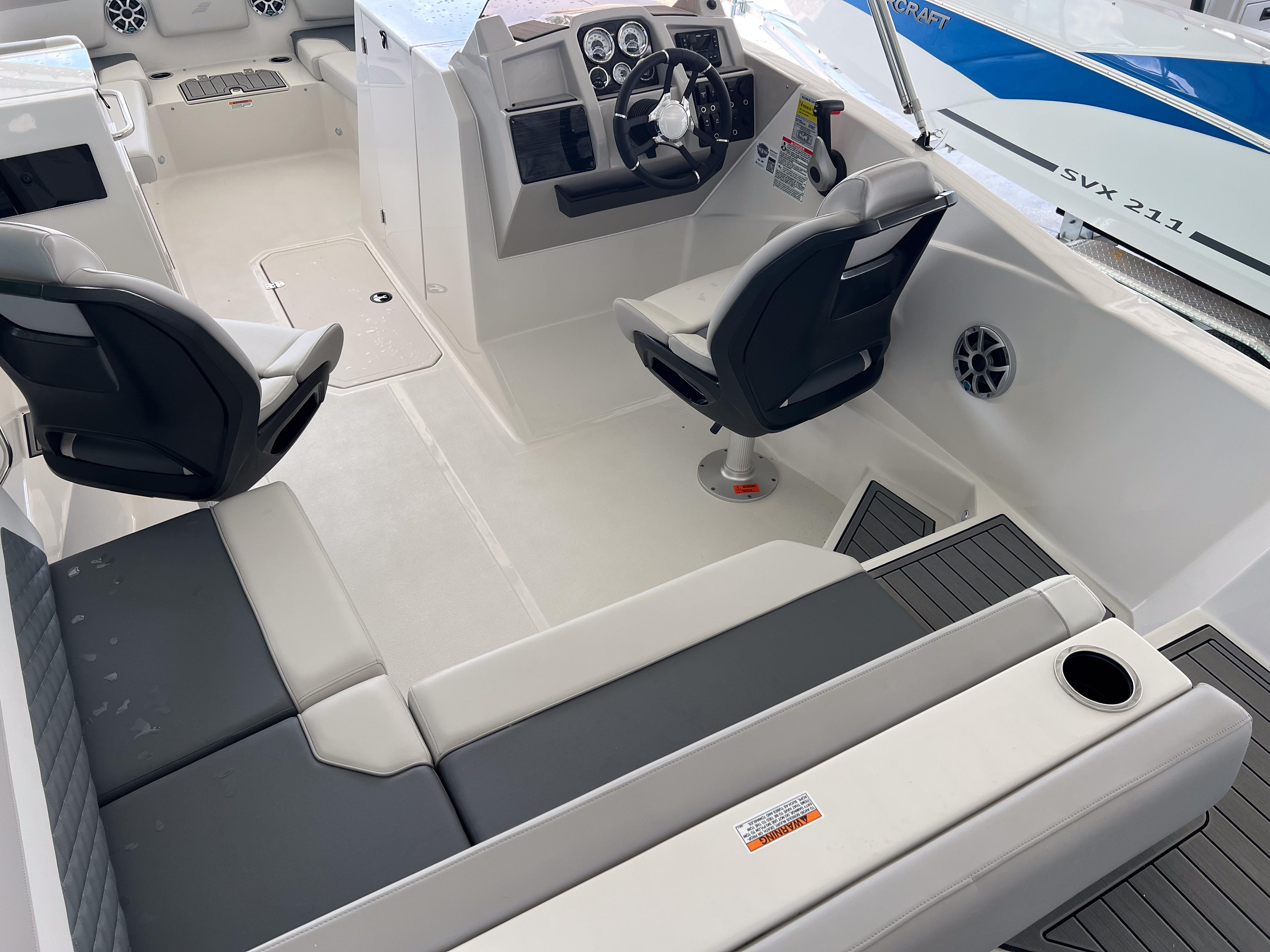 2026 Starcraft SVX 231 OB boat interior with seating, steering console, and modern design.