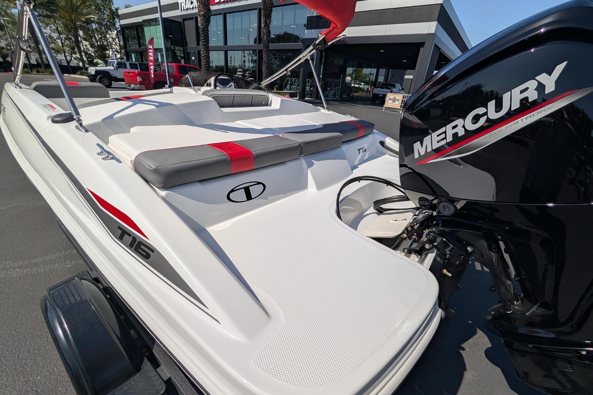 2026 Tahoe T16 boat with Mercury engine, displayed outdoors near dealership.