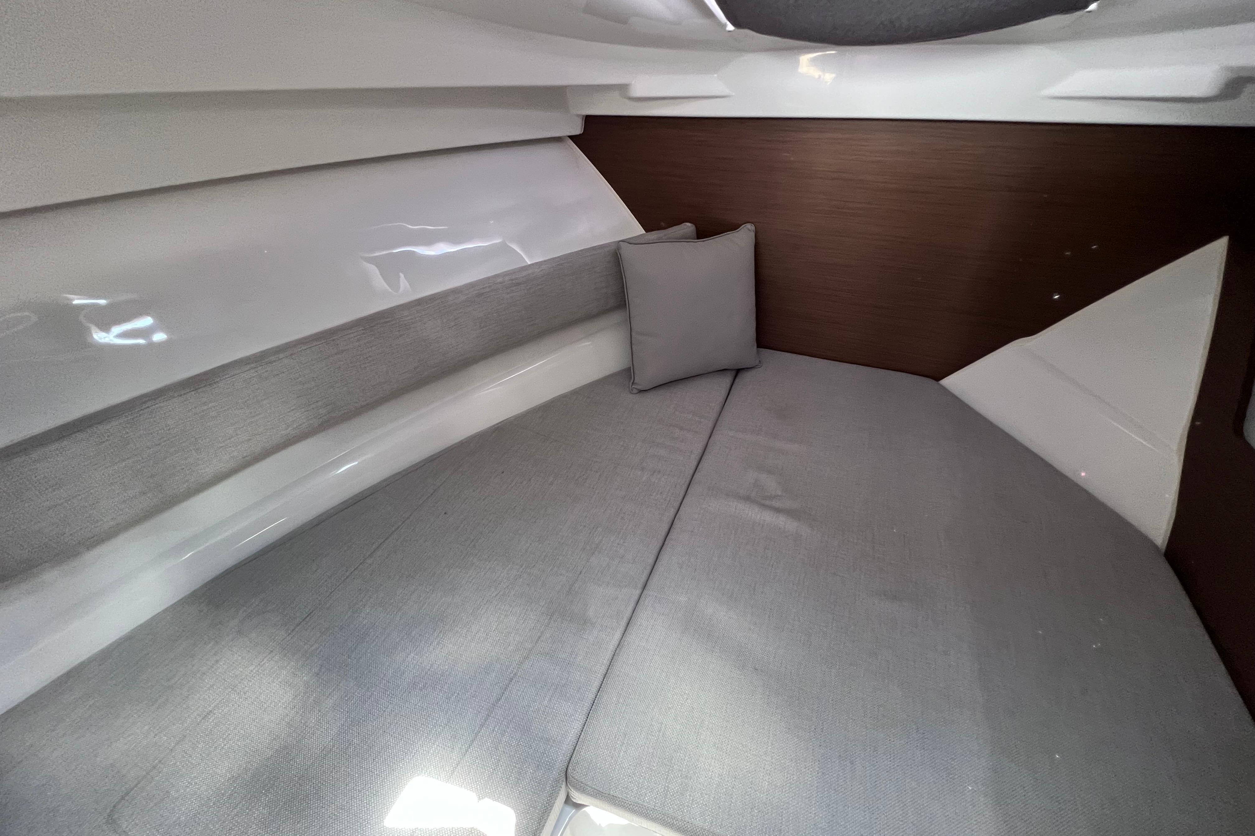 Interior cabin of 2021 Jeanneau NC Weekender 795 Series 2 with gray cushions.