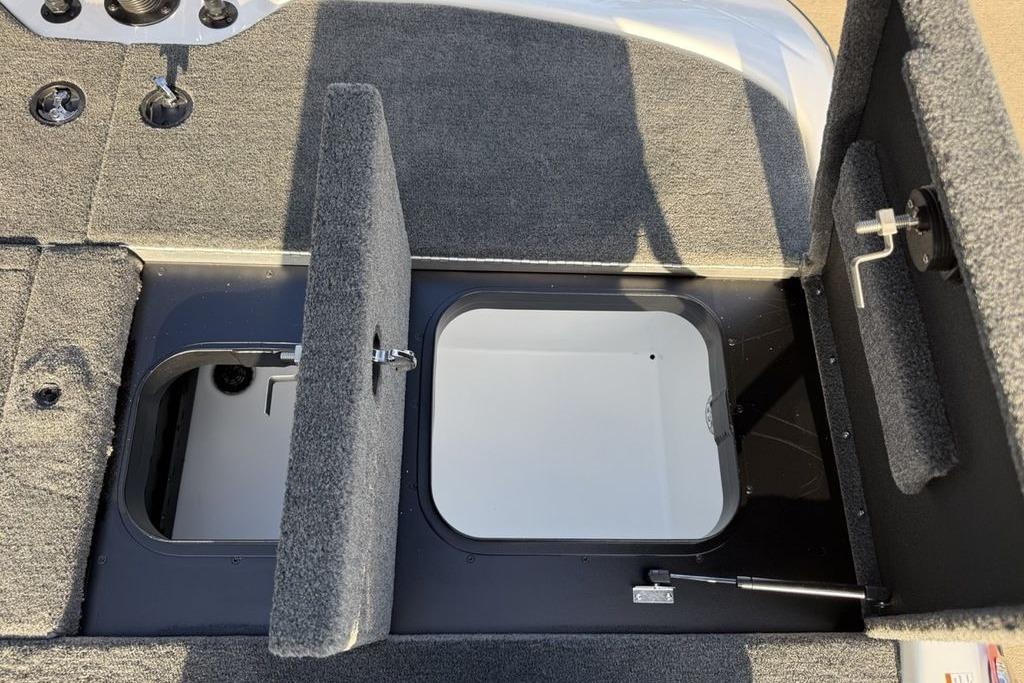 Open storage compartments on a 2026 Skeeter ZXR19 SE boat deck.